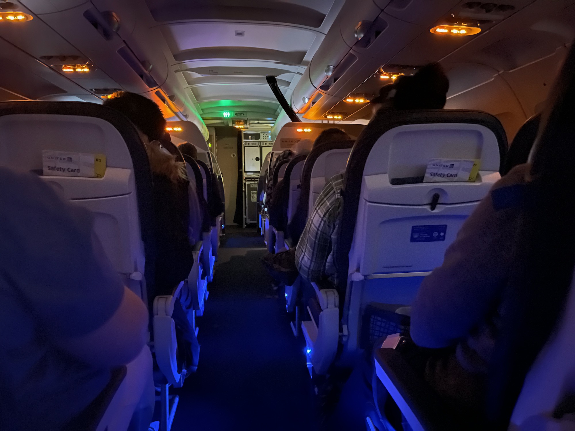 a group of people sitting in an airplane