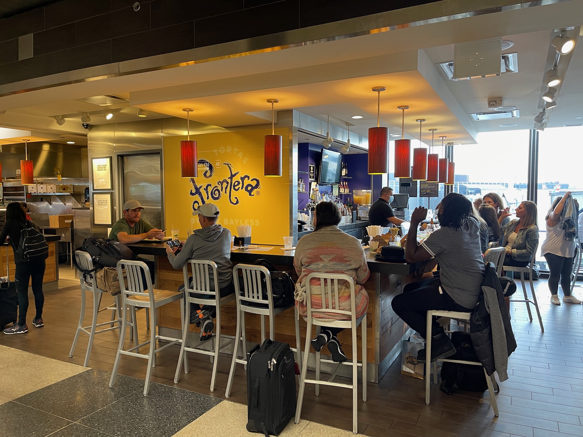 people sitting at a bar