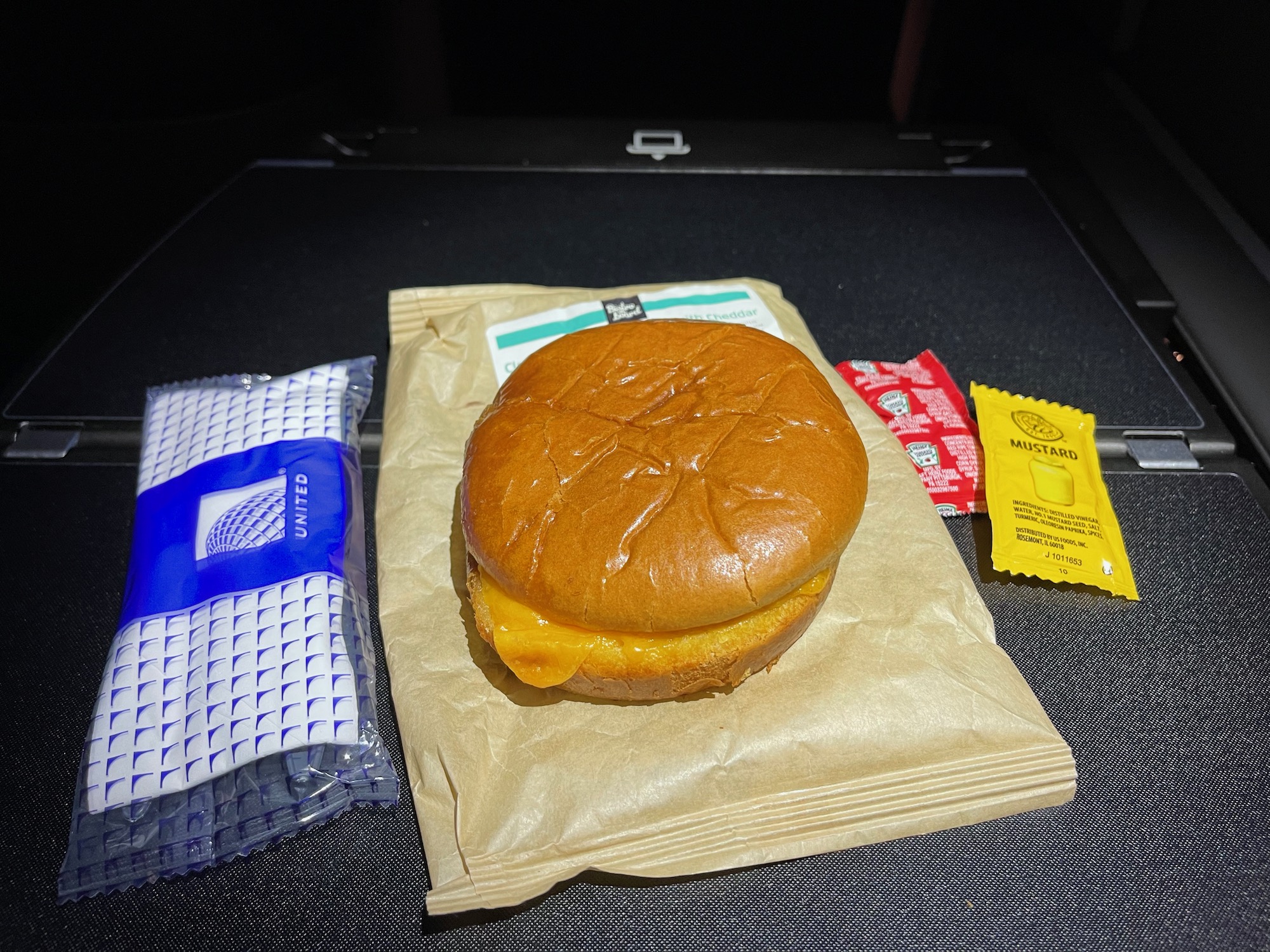 a cheeseburger on a paper wrapper