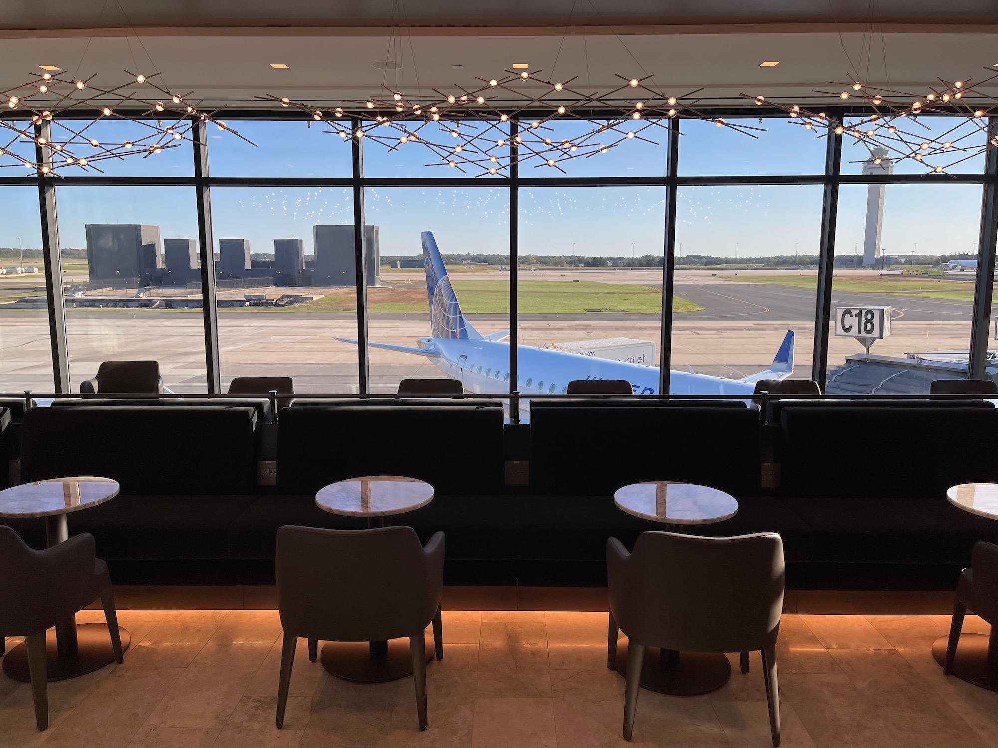 a room with a large window and a plane