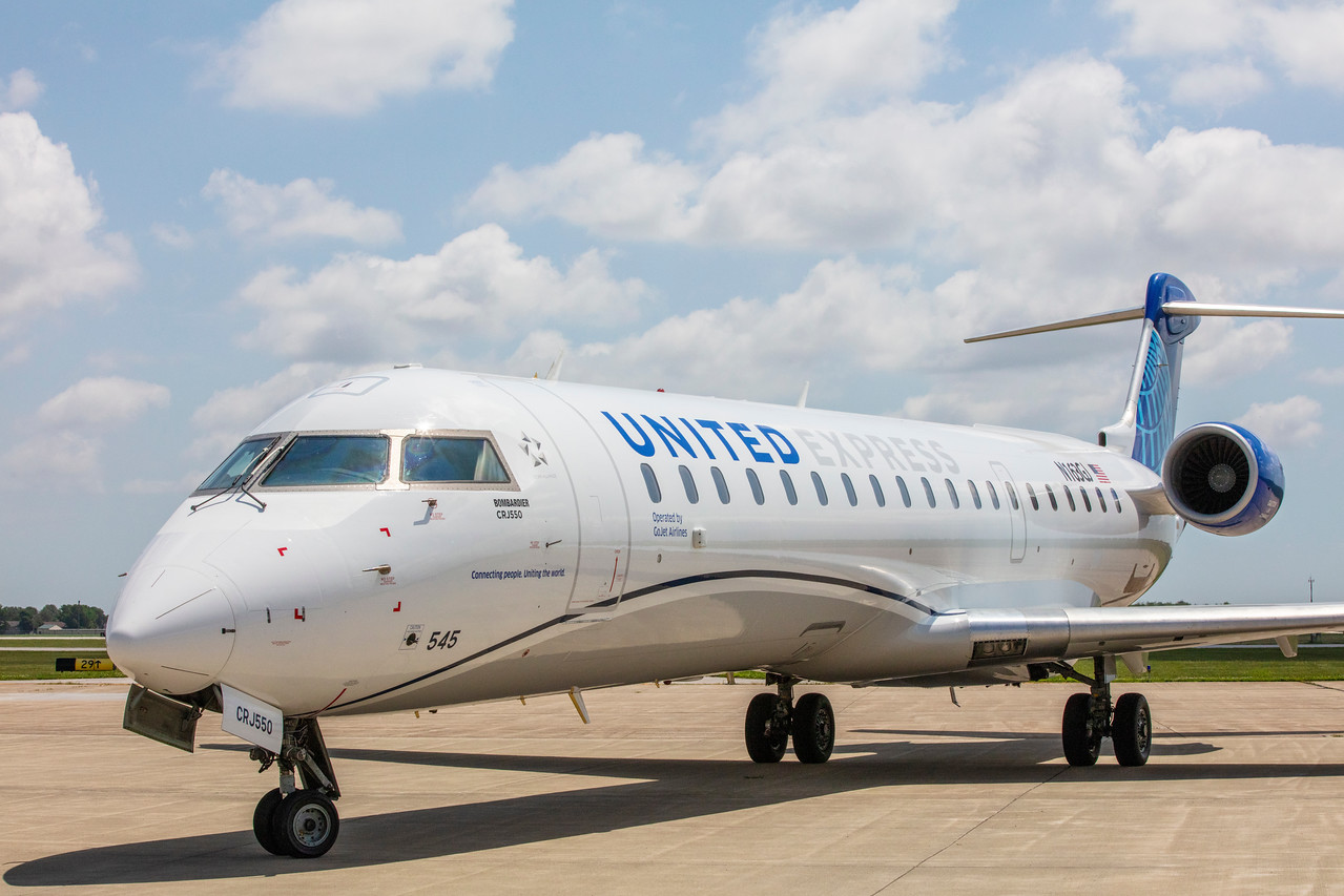 a white airplane on a runway