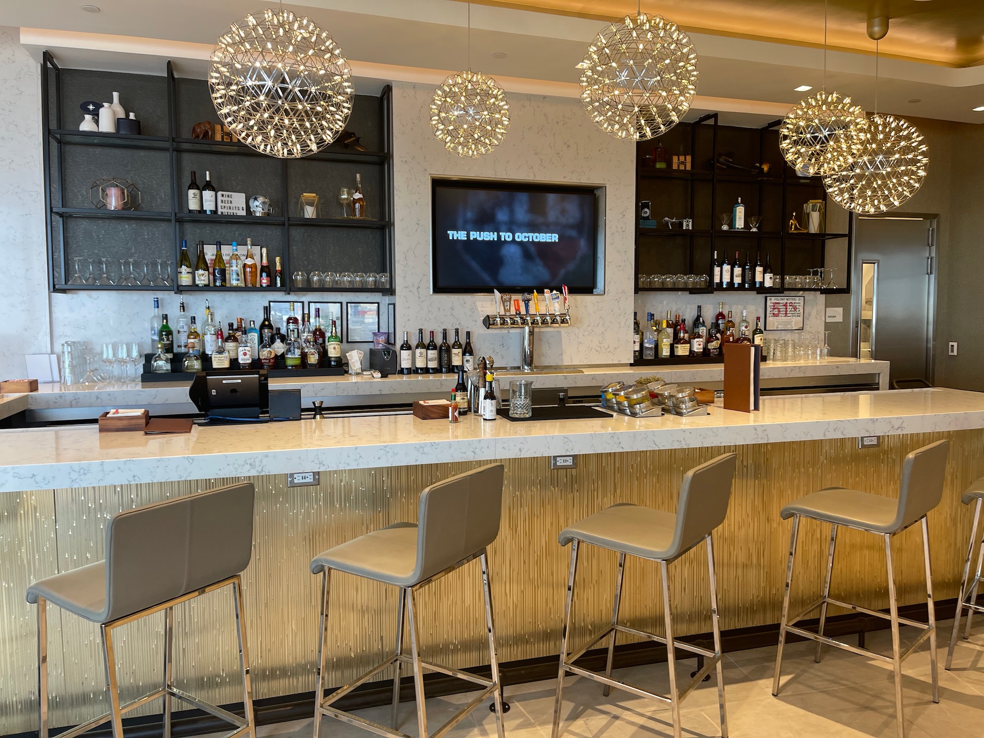 a bar with lights from the ceiling