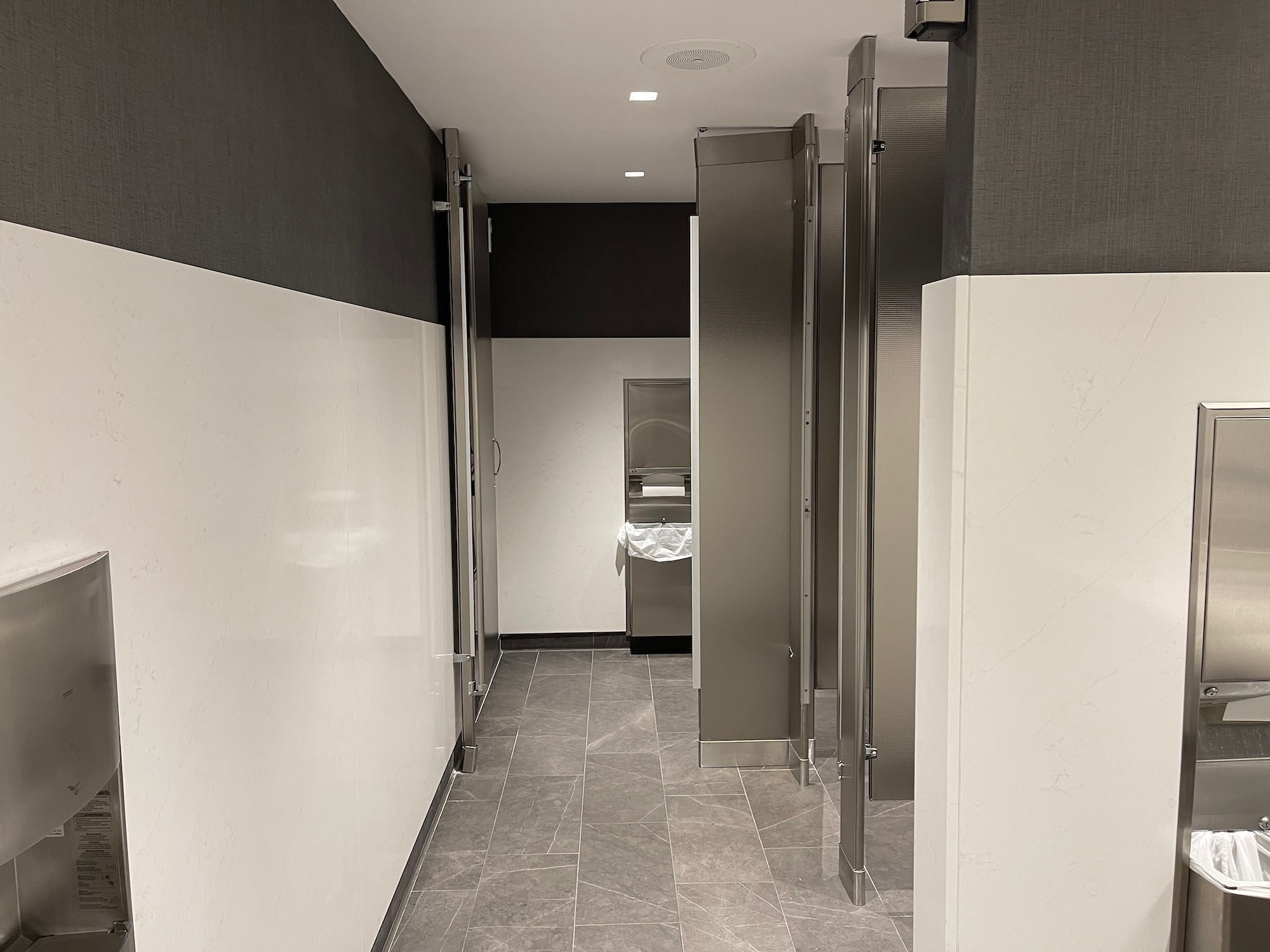 a bathroom with stainless steel doors