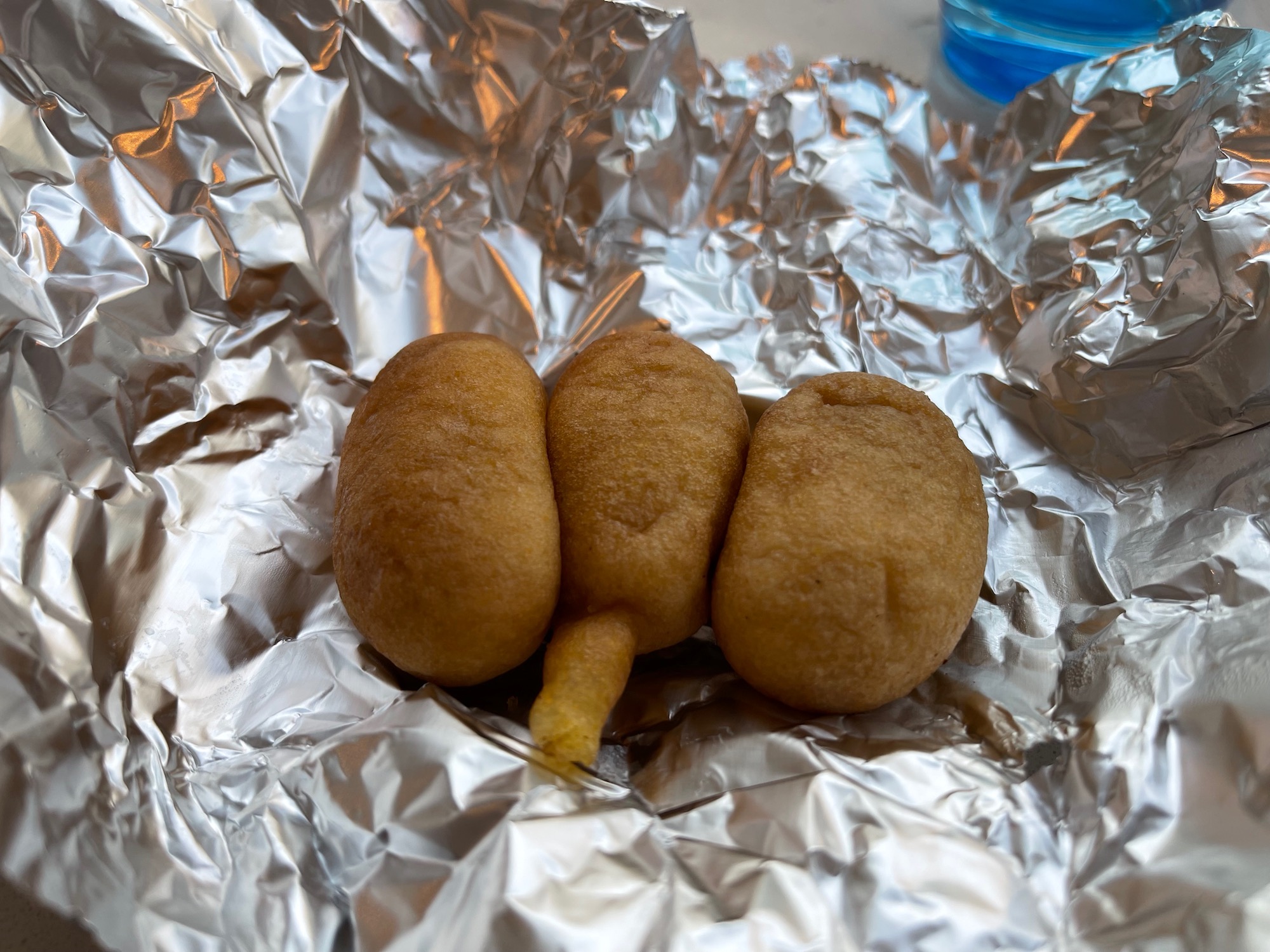 a group of fried food on a foil