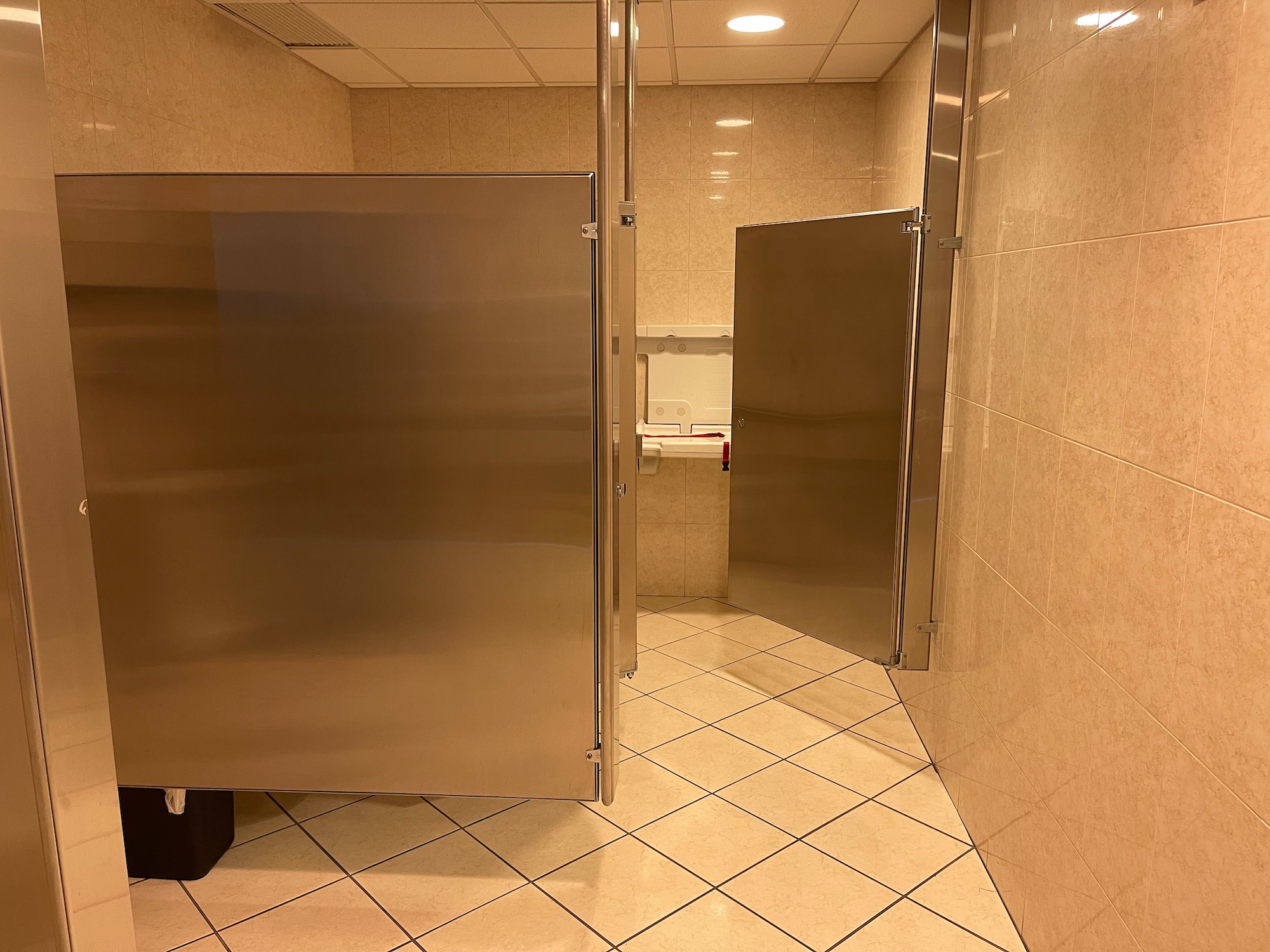 a bathroom with two doors