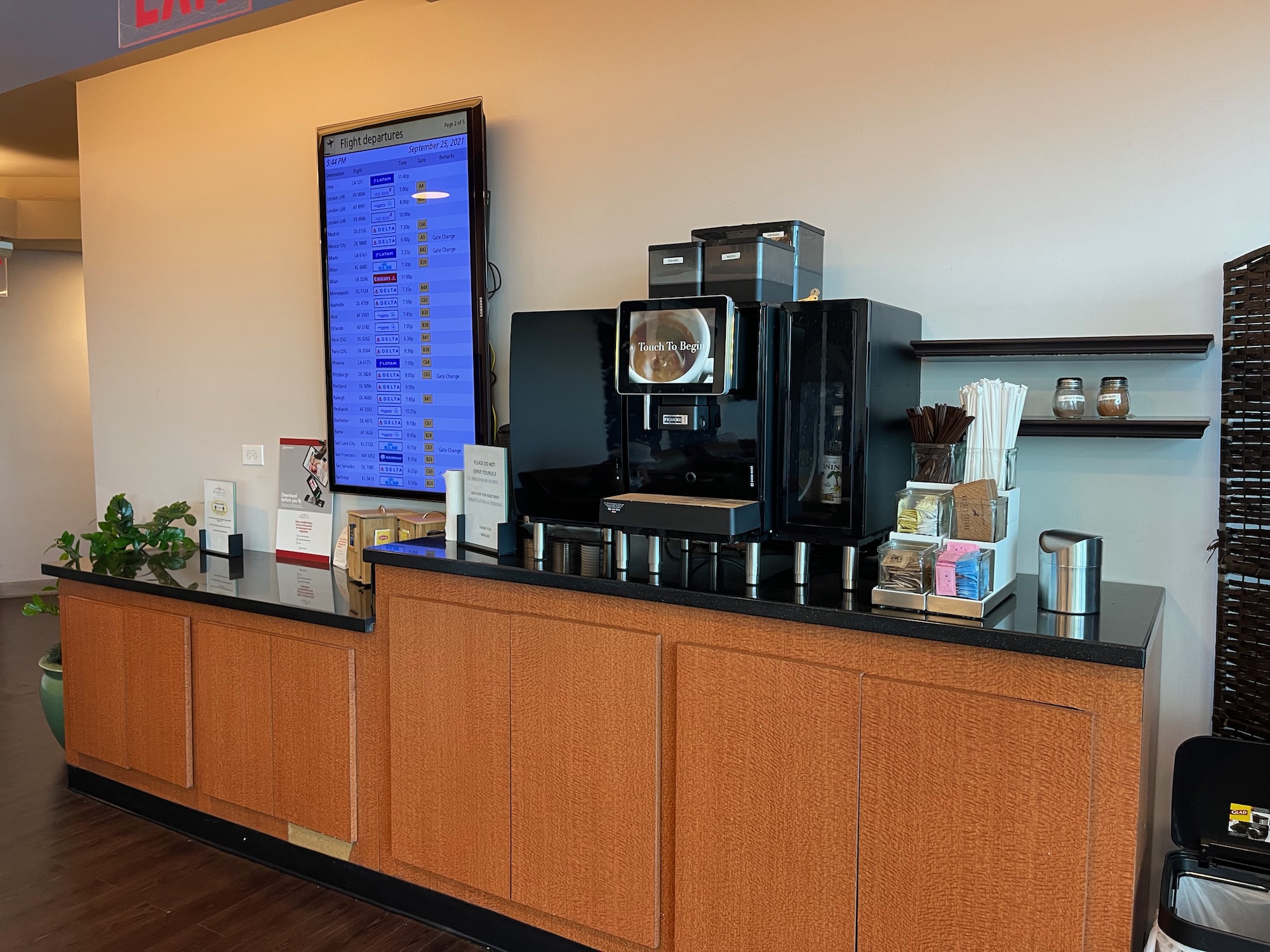 a coffee machine and a monitor on a counter