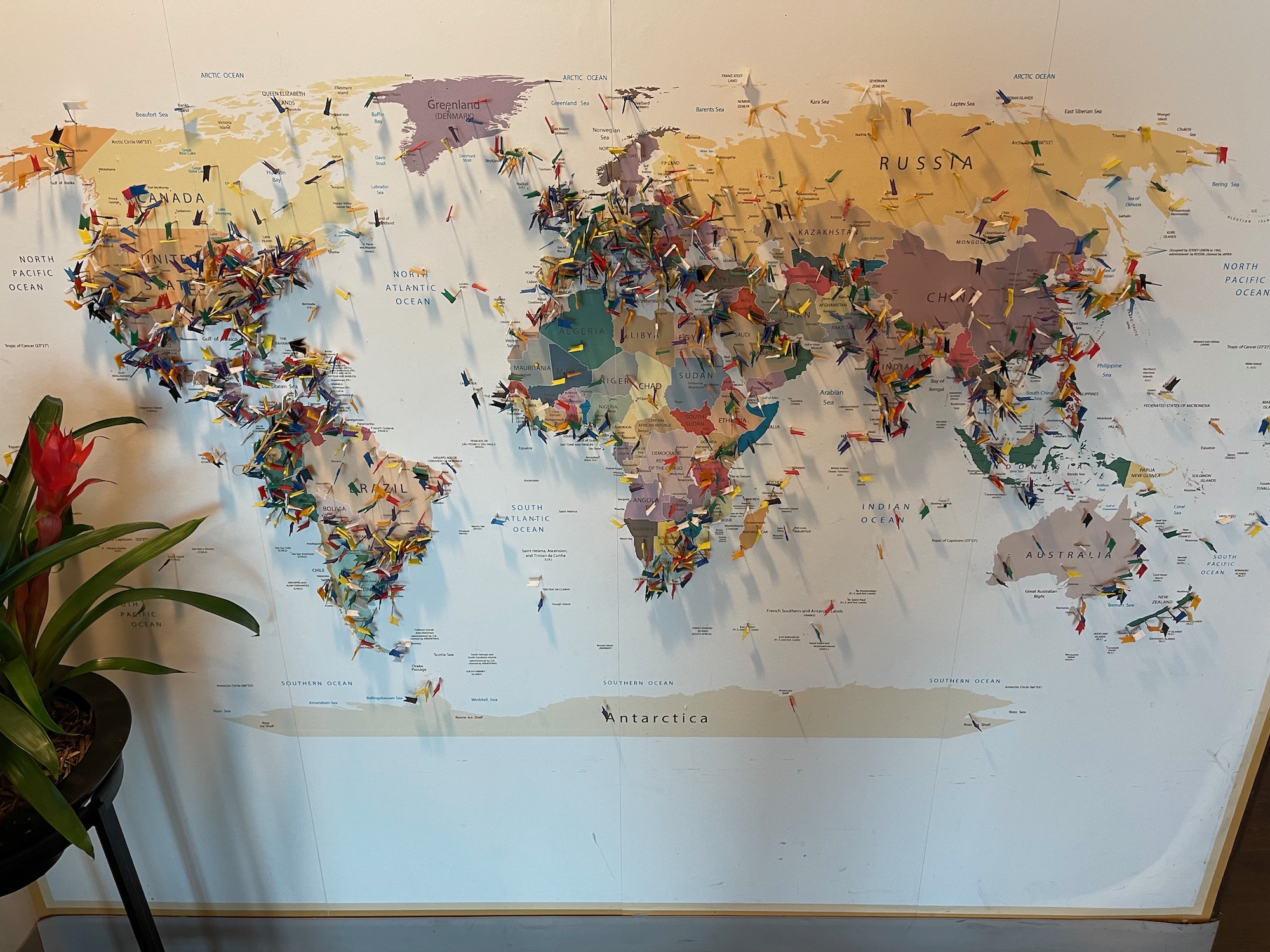 a map of the world with pins on it