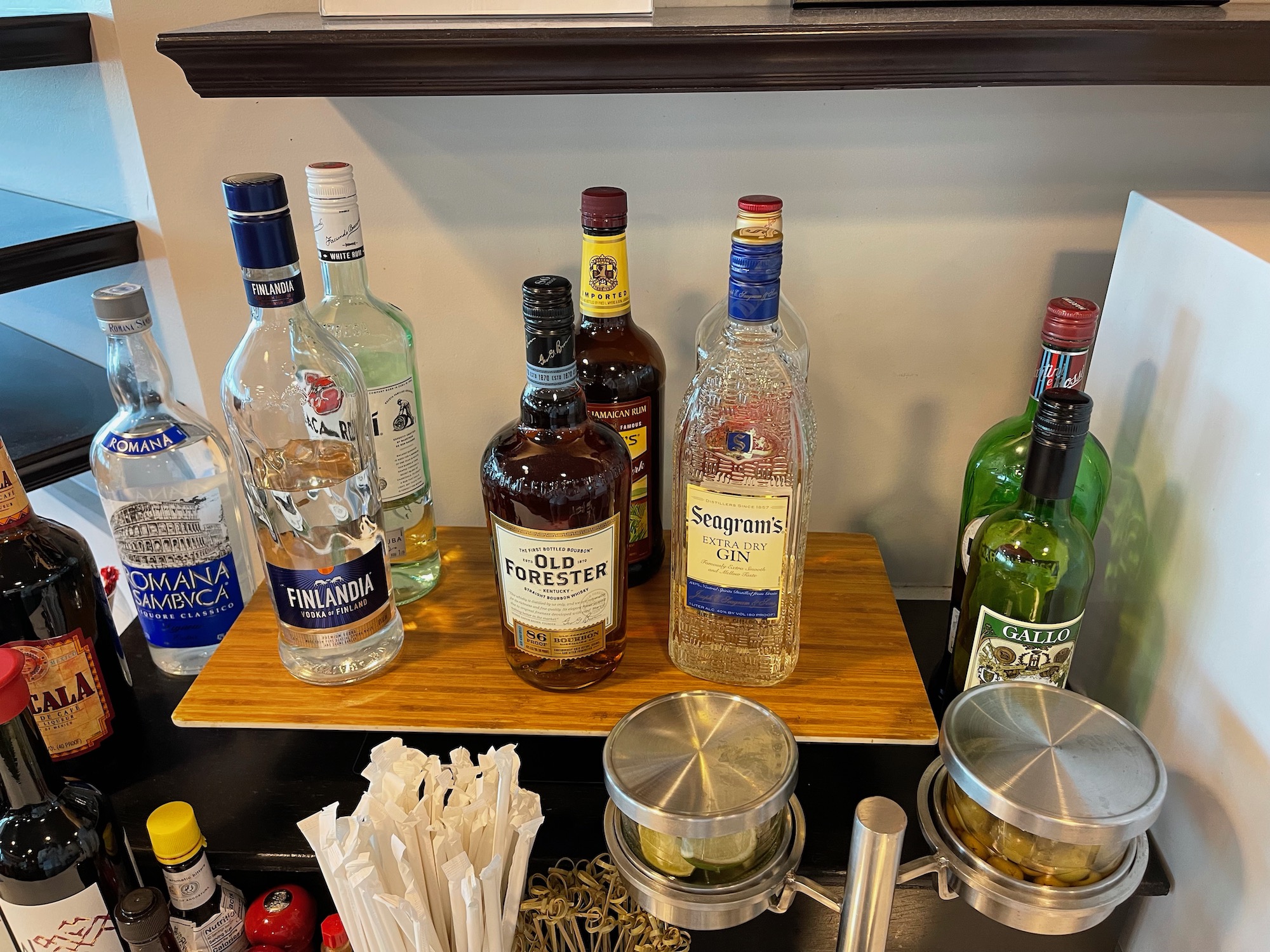 a group of bottles of alcohol on a wooden board