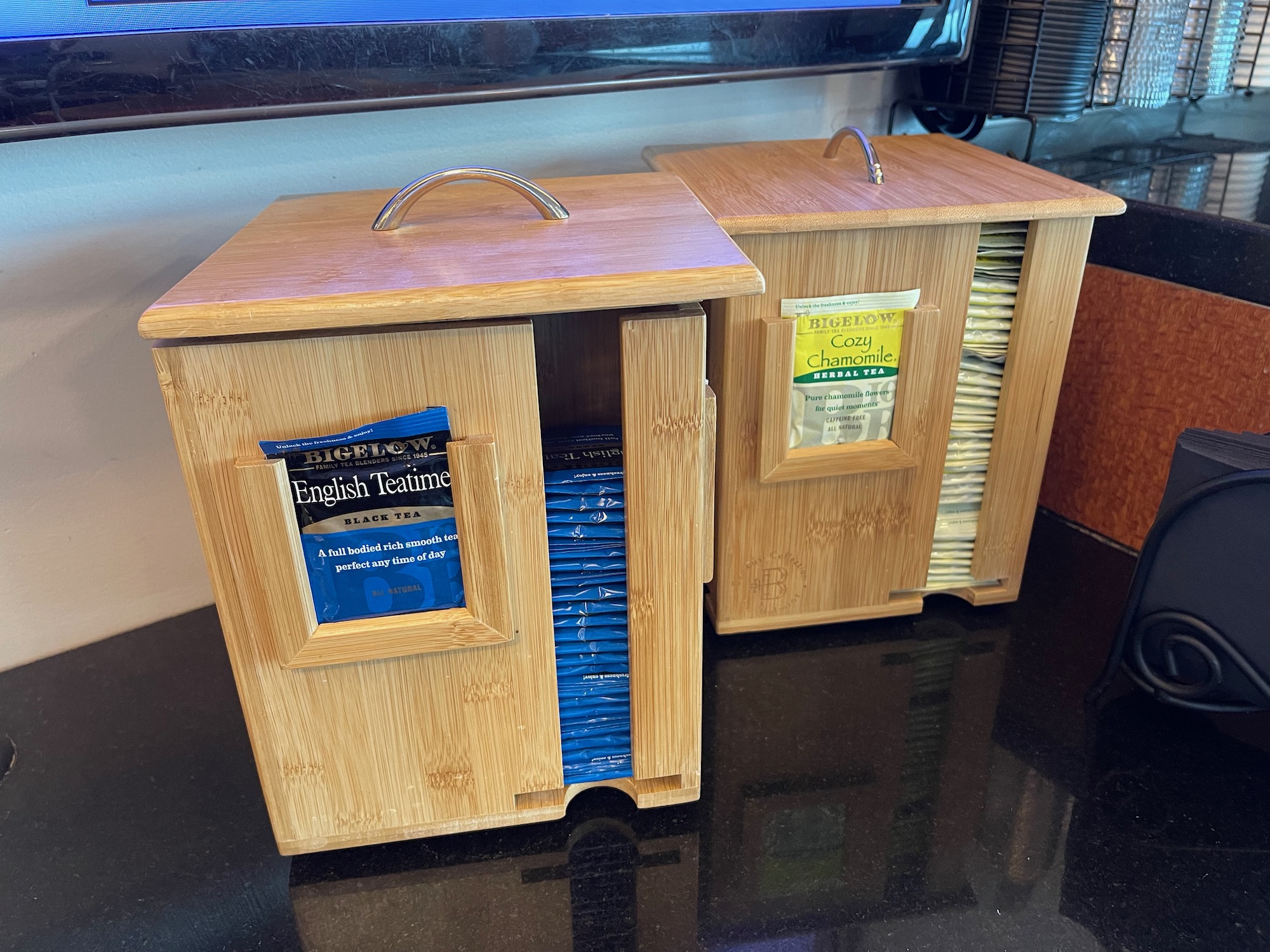 a wooden box with tea bags in it