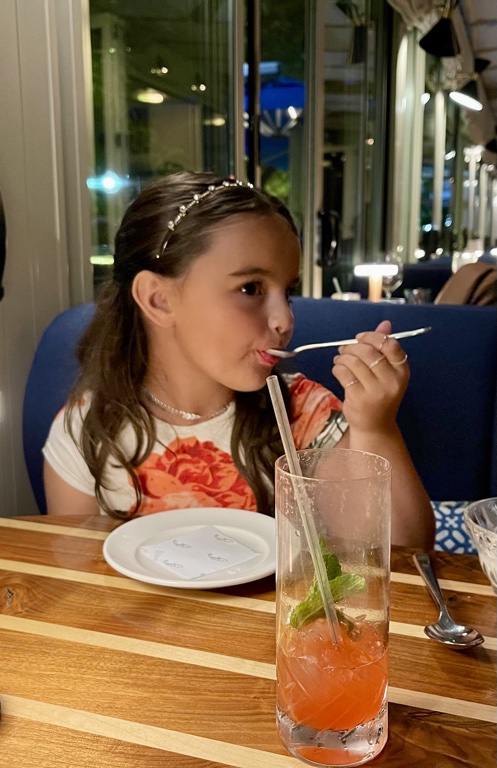 lucy enjoying ice cream at Fiola Mare