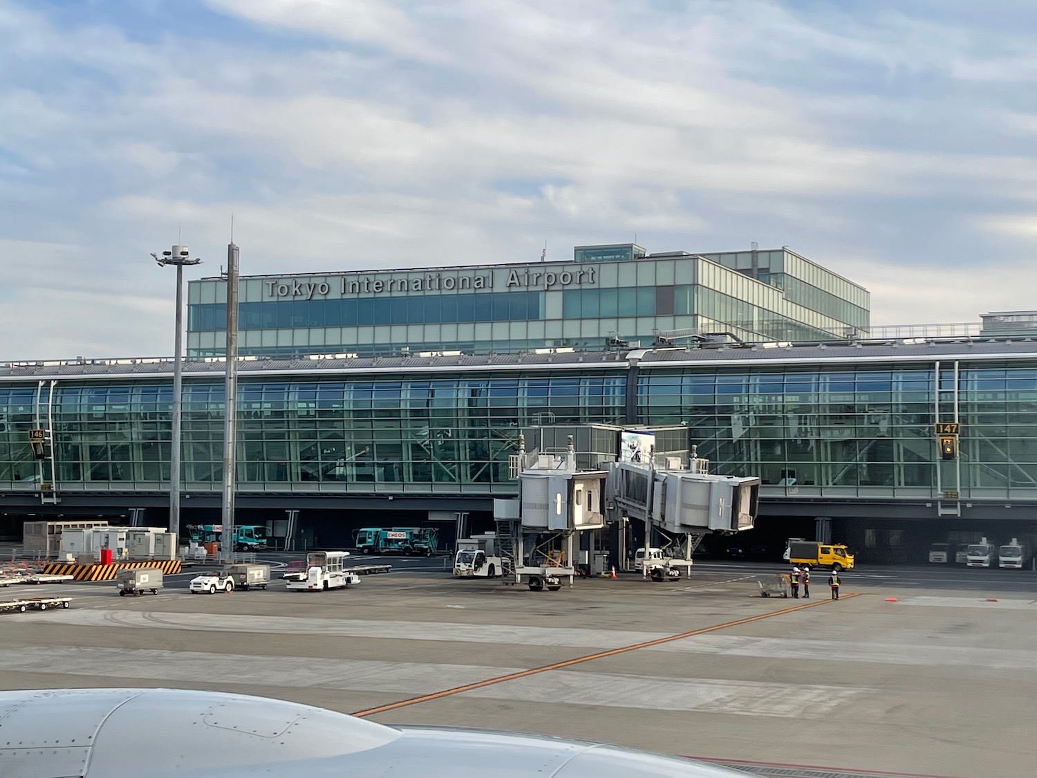 a large building with a lot of vehicles parked outside