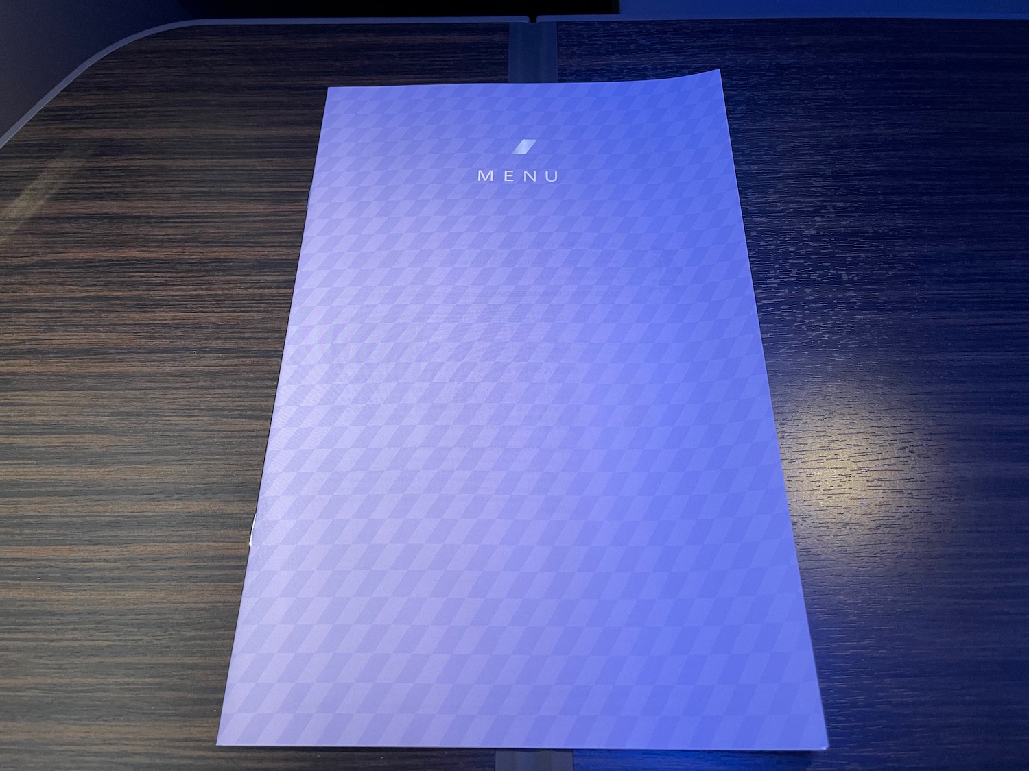a blue menu on a table