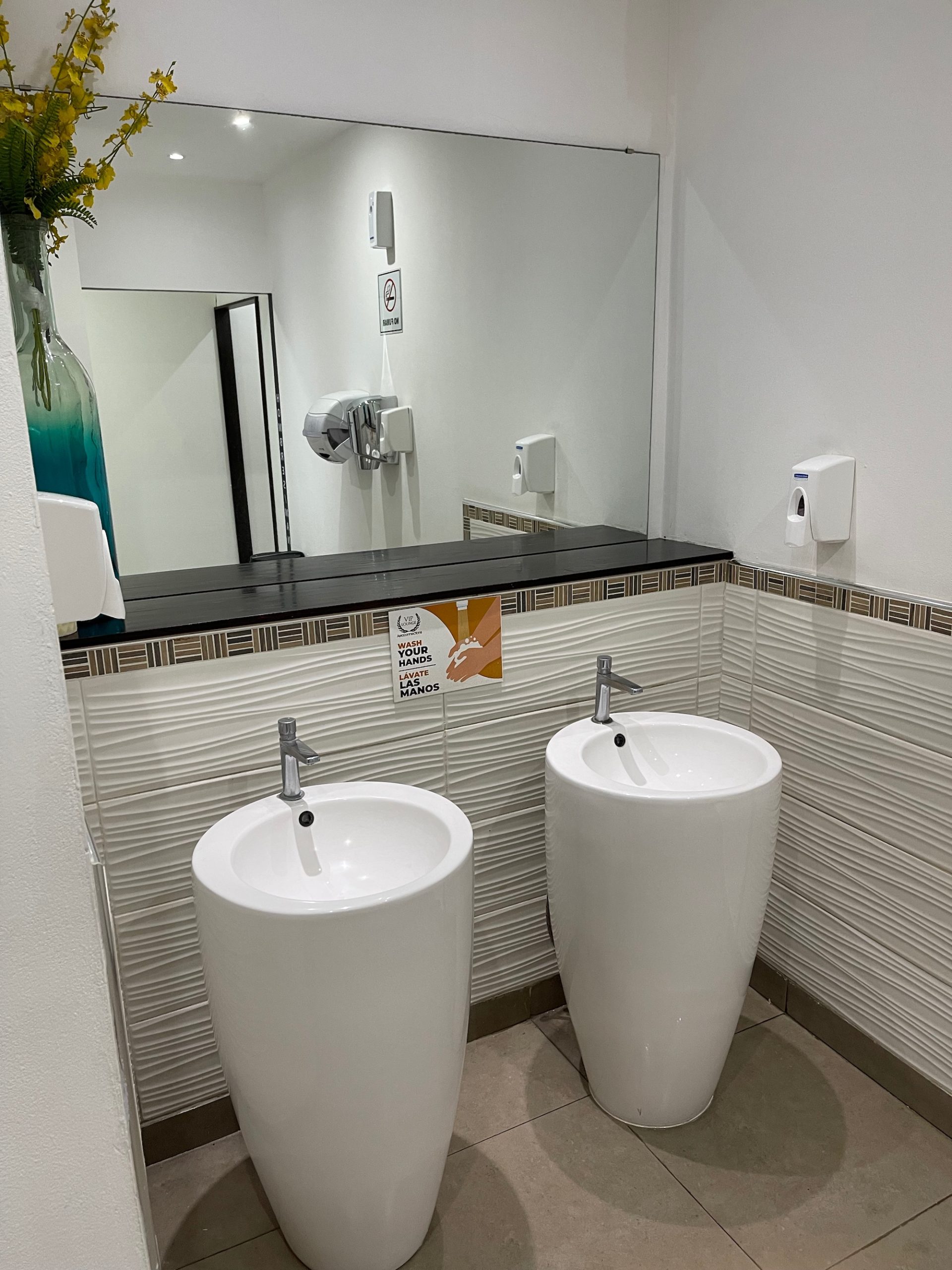 a bathroom with two urinals