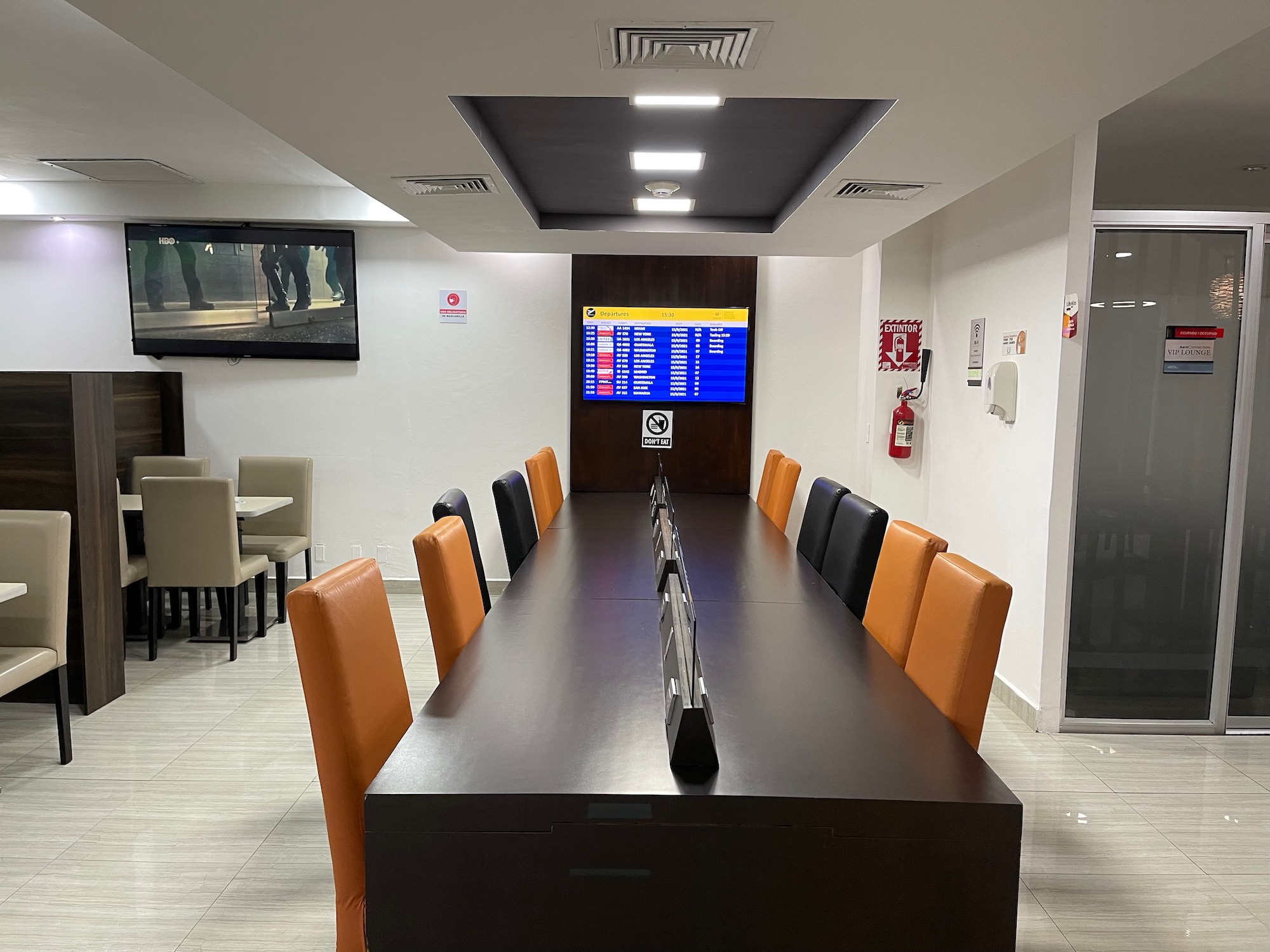 a conference room with a table and chairs