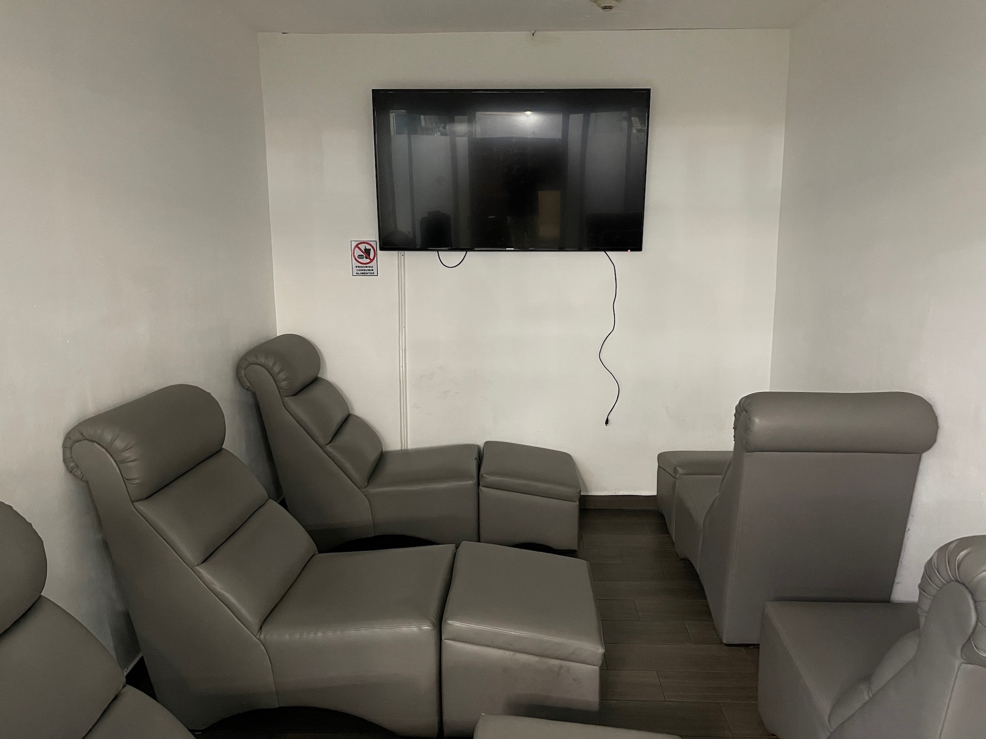 a room with a television on the wall