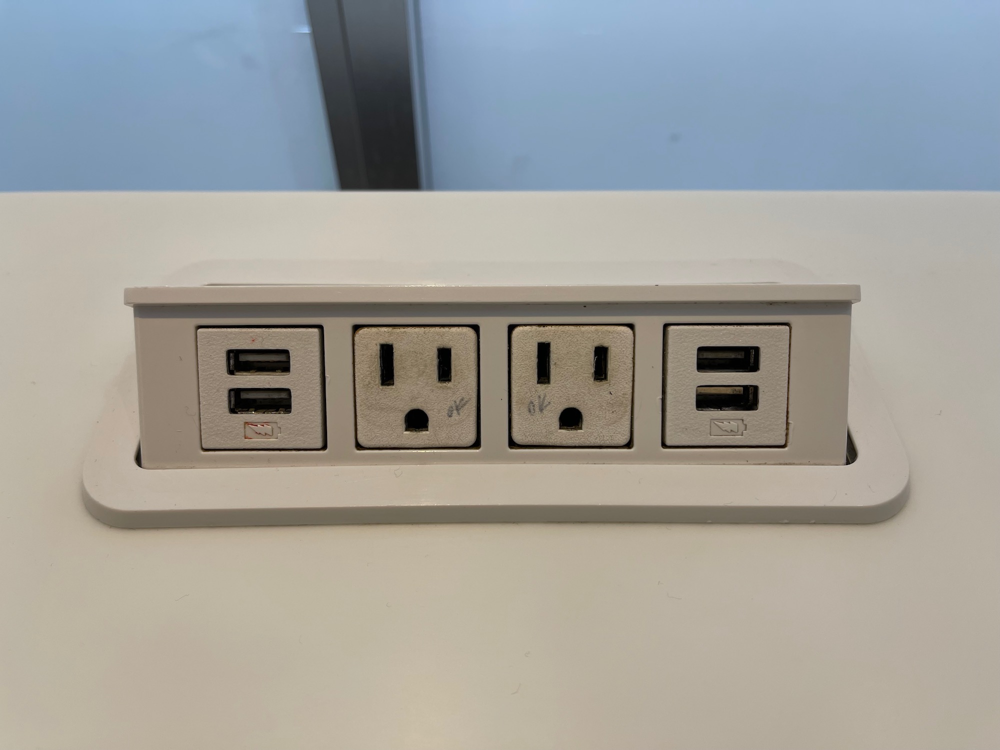 a white rectangular outlet with multiple ports