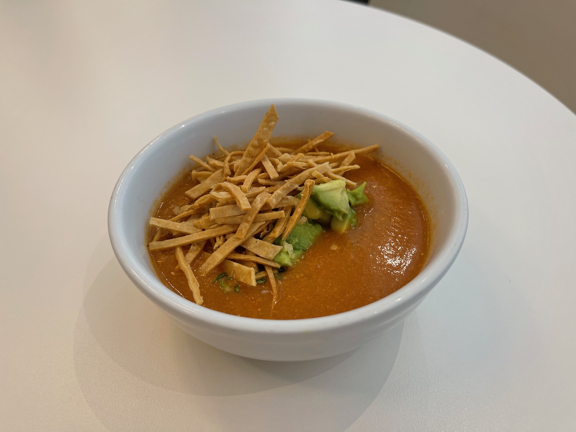 a bowl of soup with tortilla chips