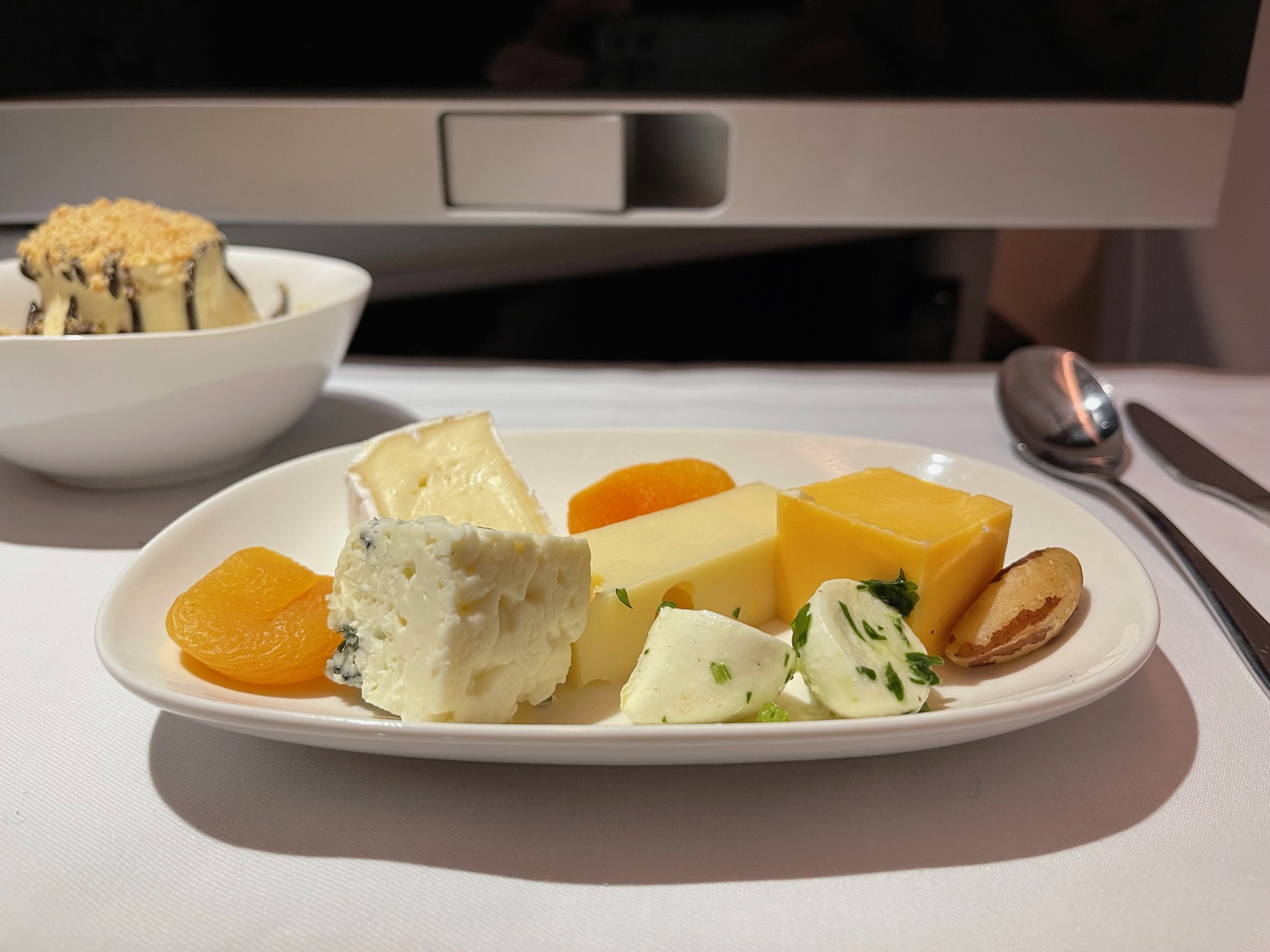 a plate of cheese and fruit