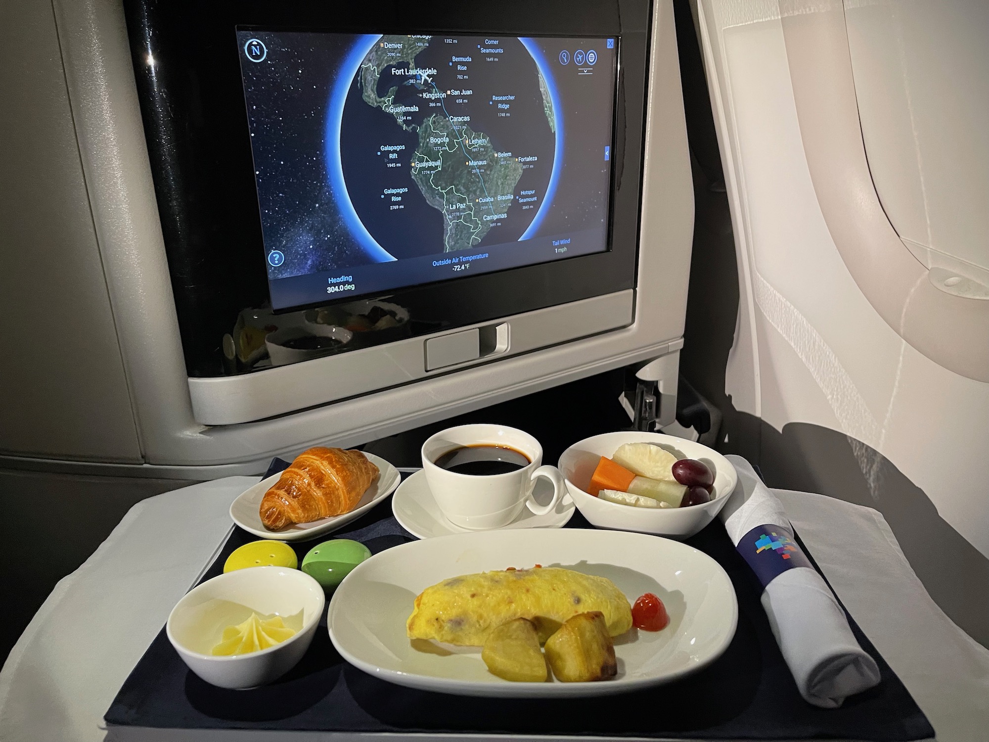 a tv on the tray of an airplane