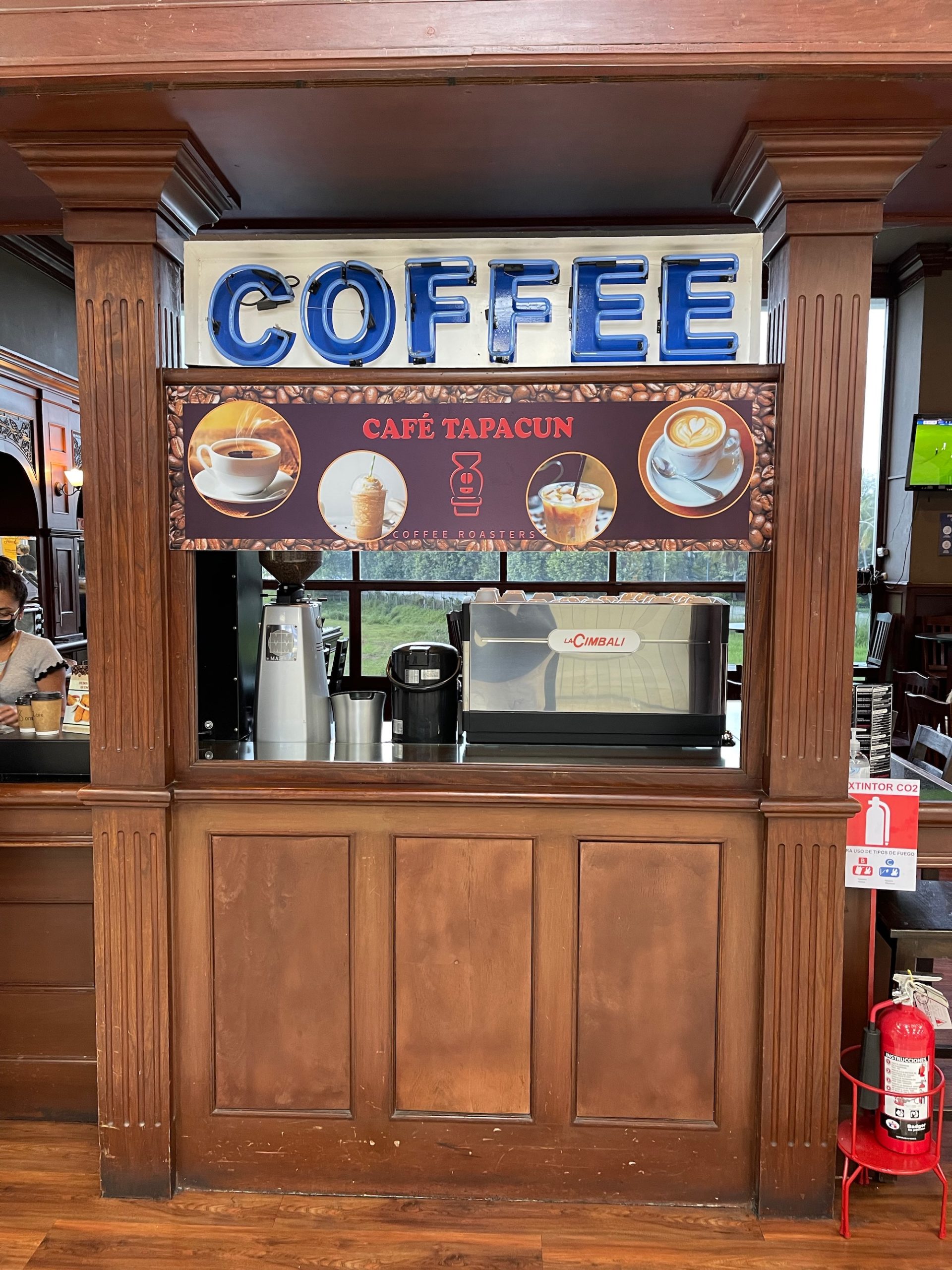 a coffee shop with a sign above it