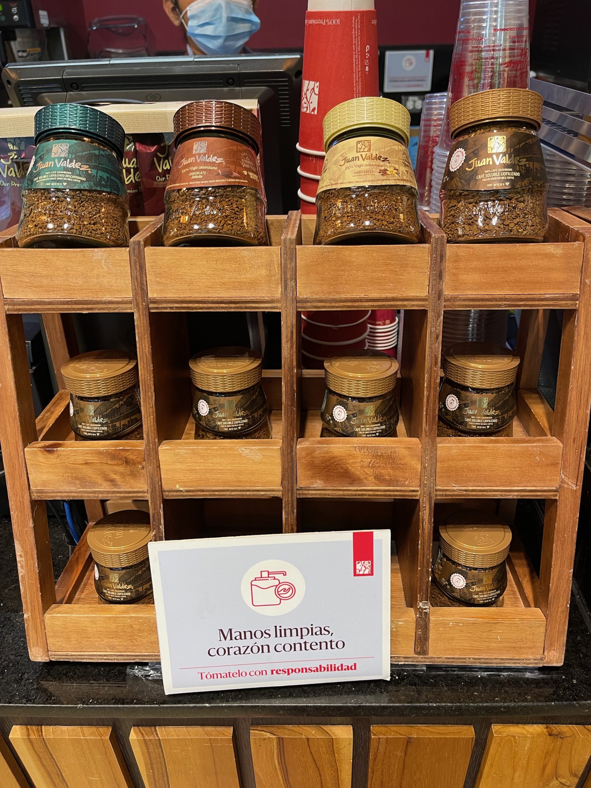 a group of jars of spices on a shelf