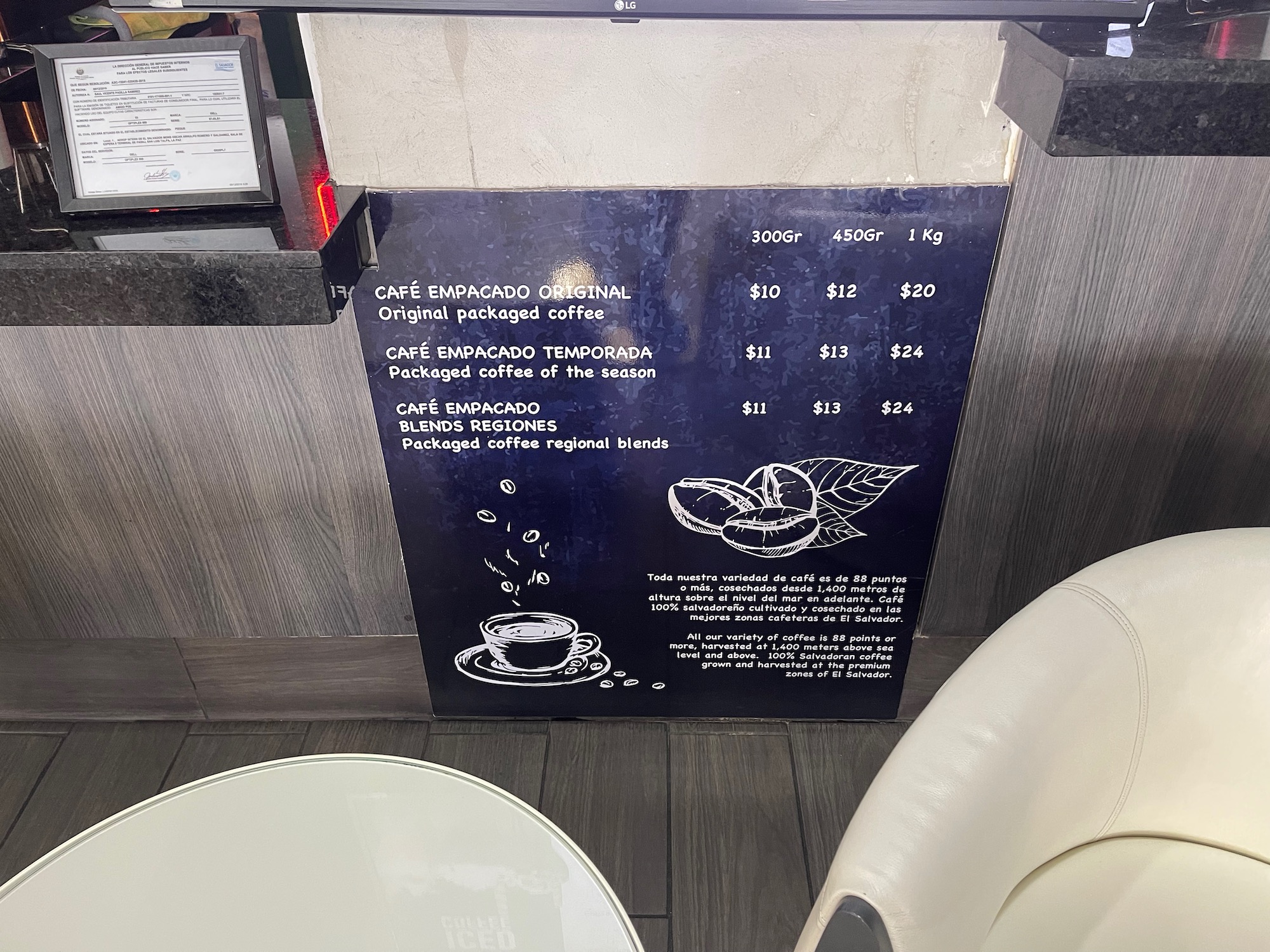 a sign with price list and a white chair