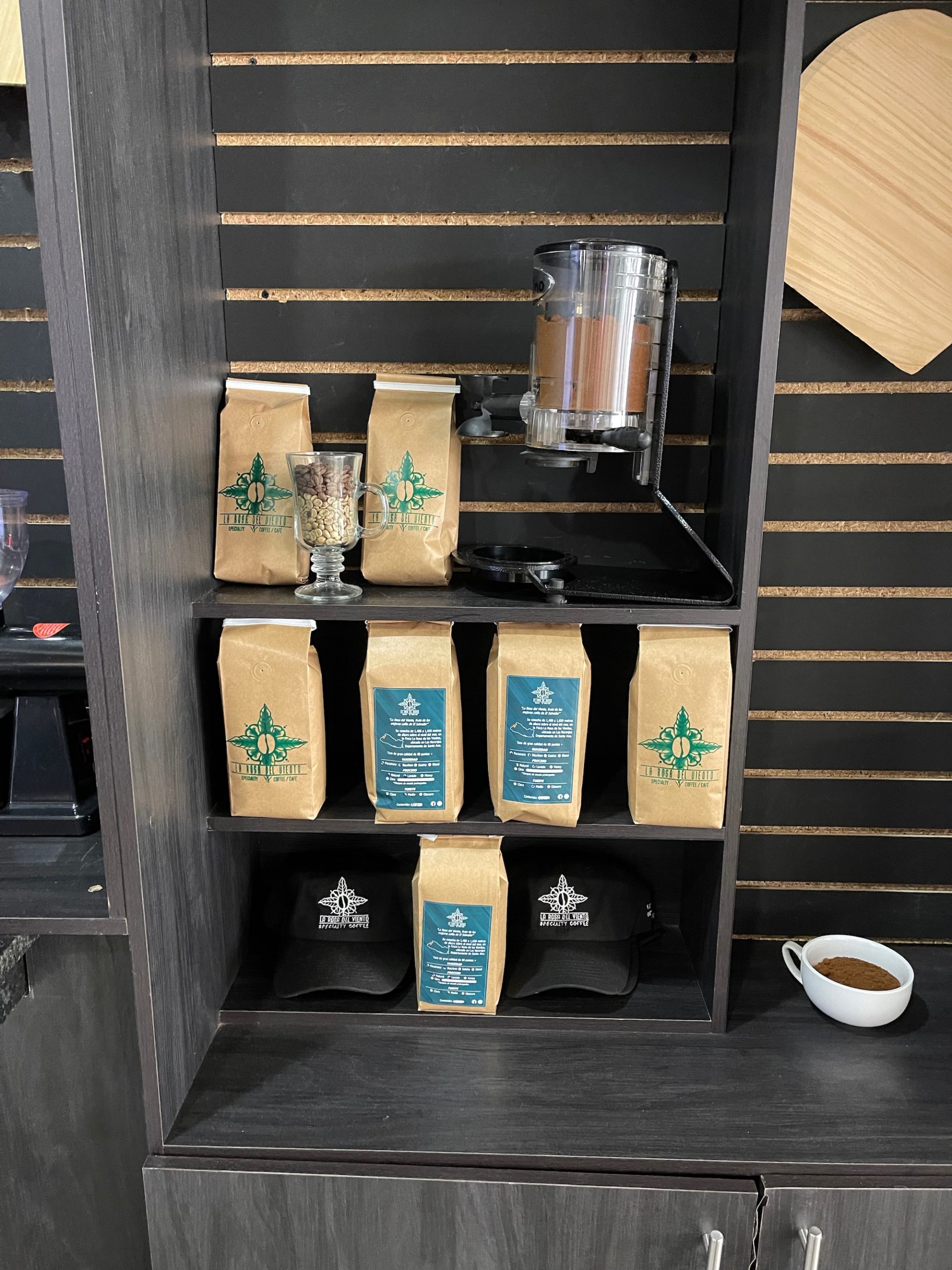a shelf with bags of coffee and other items