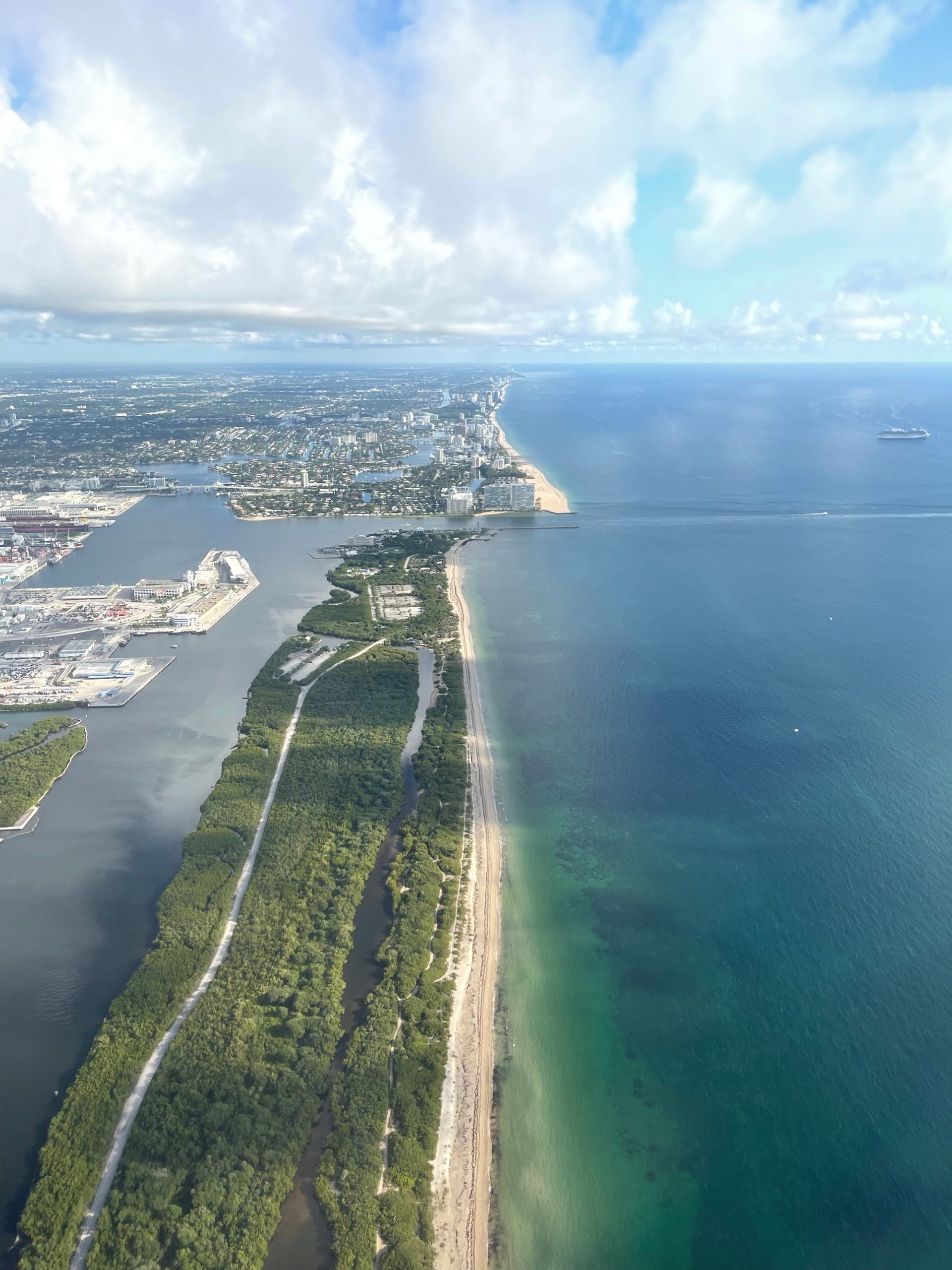 an aerial view of a beach and land