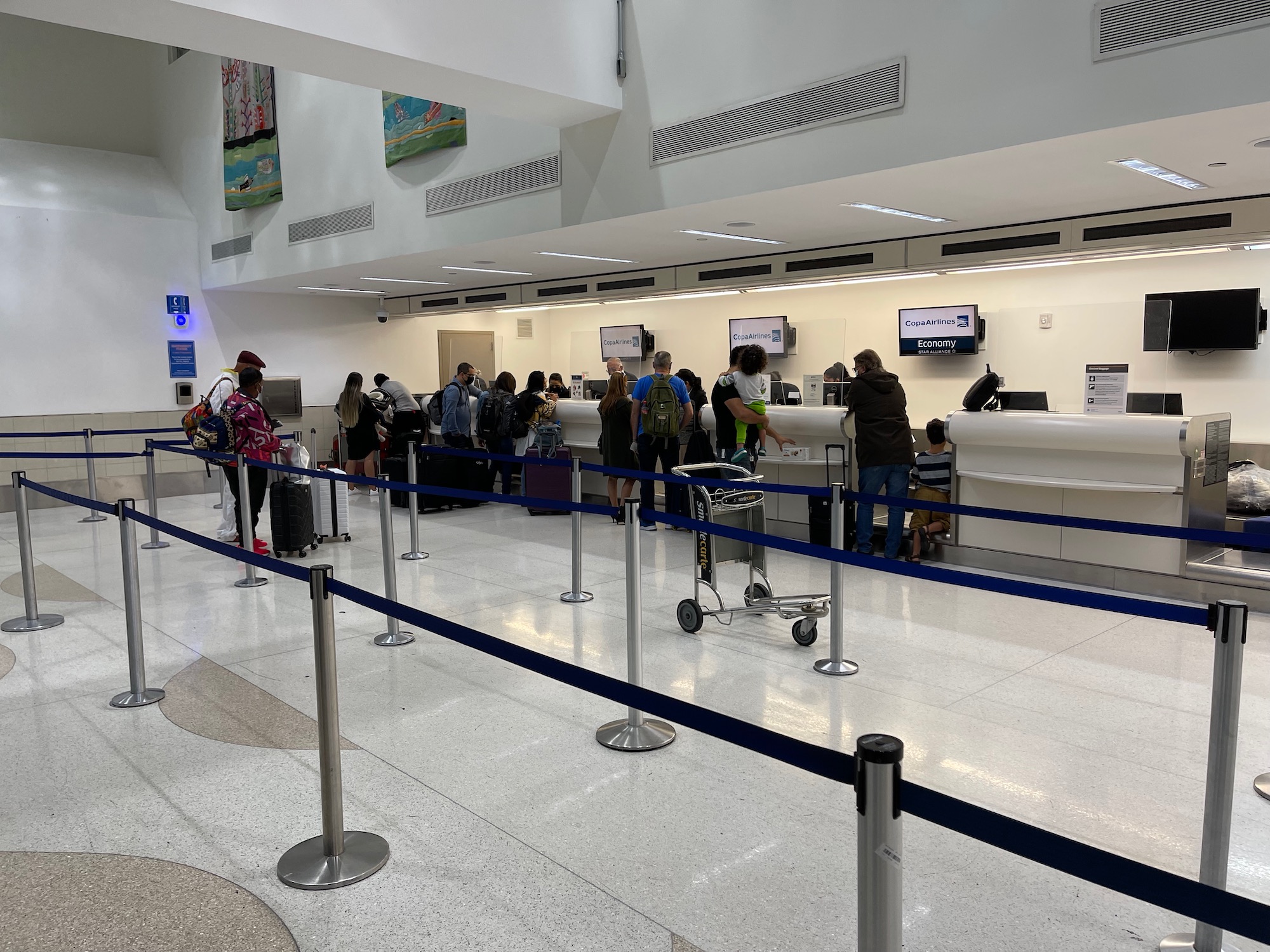 people standing in line at a check in counter