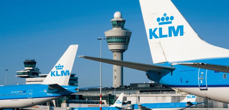 a group of airplanes at an airport