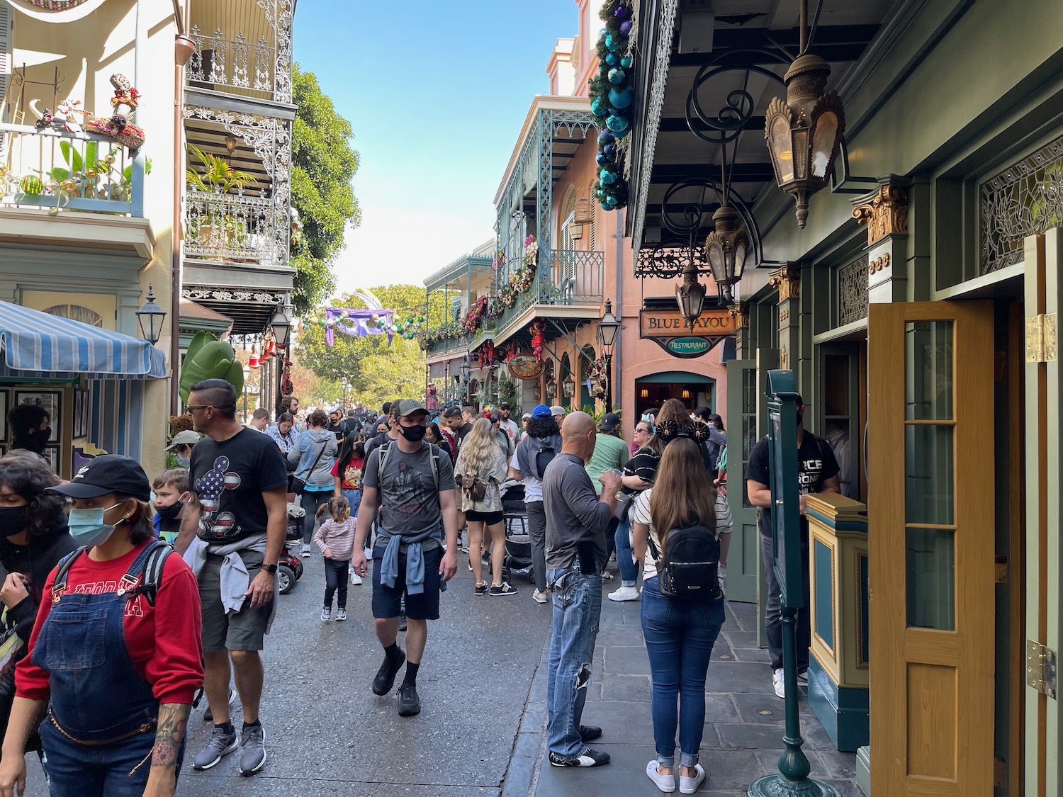 a group of people walking down a street