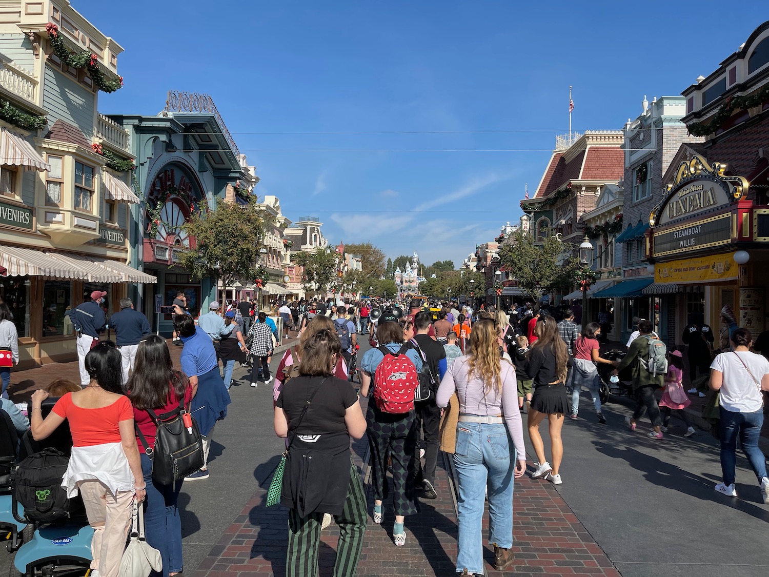 a group of people walking on a street