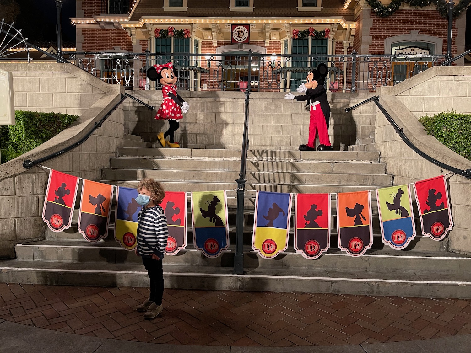 a group of people standing on stairs outside a building