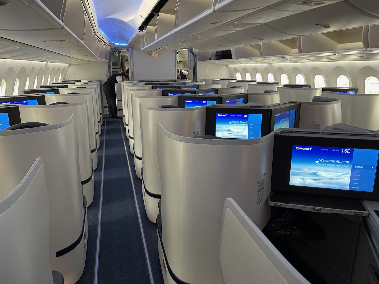 a row of rows of monitors on an airplane