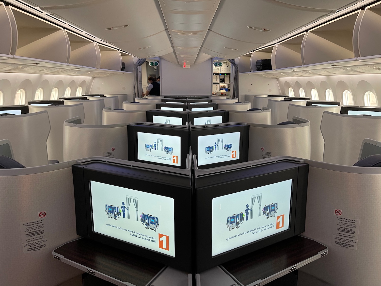 a row of monitors in an airplane