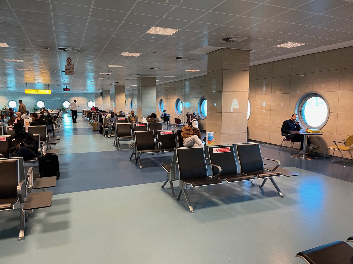 a group of people sitting in chairs in a building