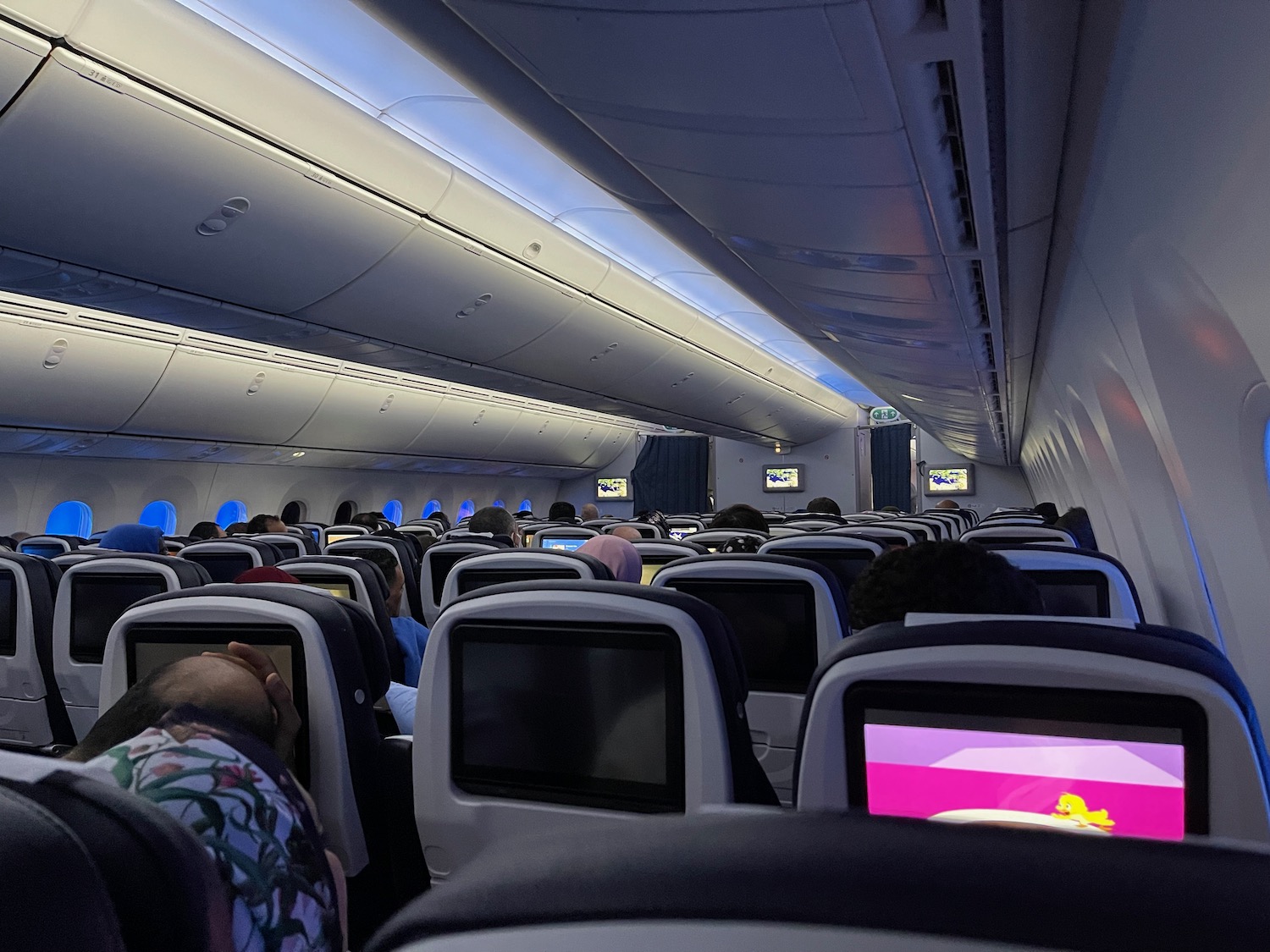 a group of people sitting in an airplane