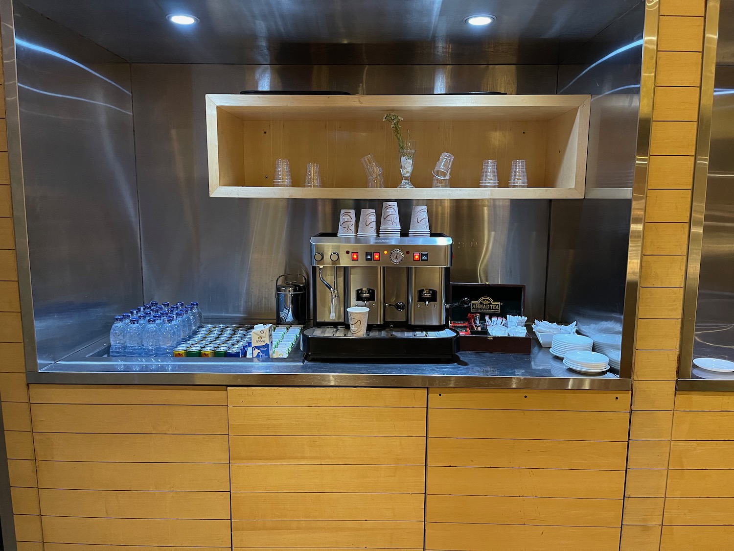 a coffee machine and bottles on a counter