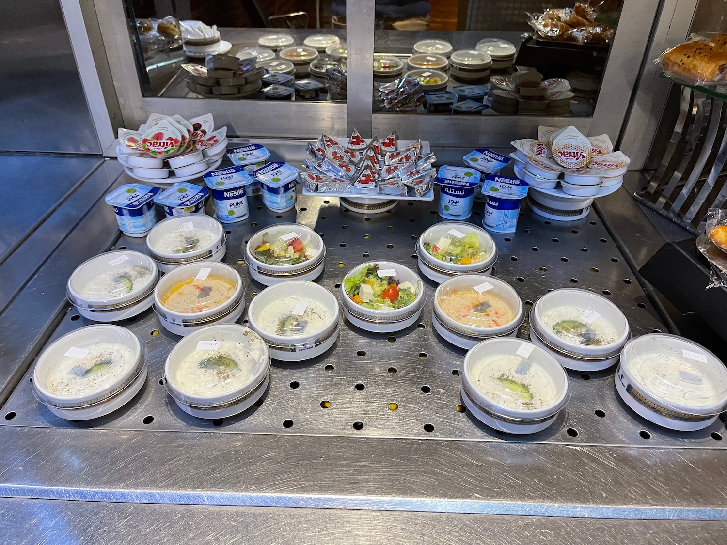 a group of bowls of food on a counter