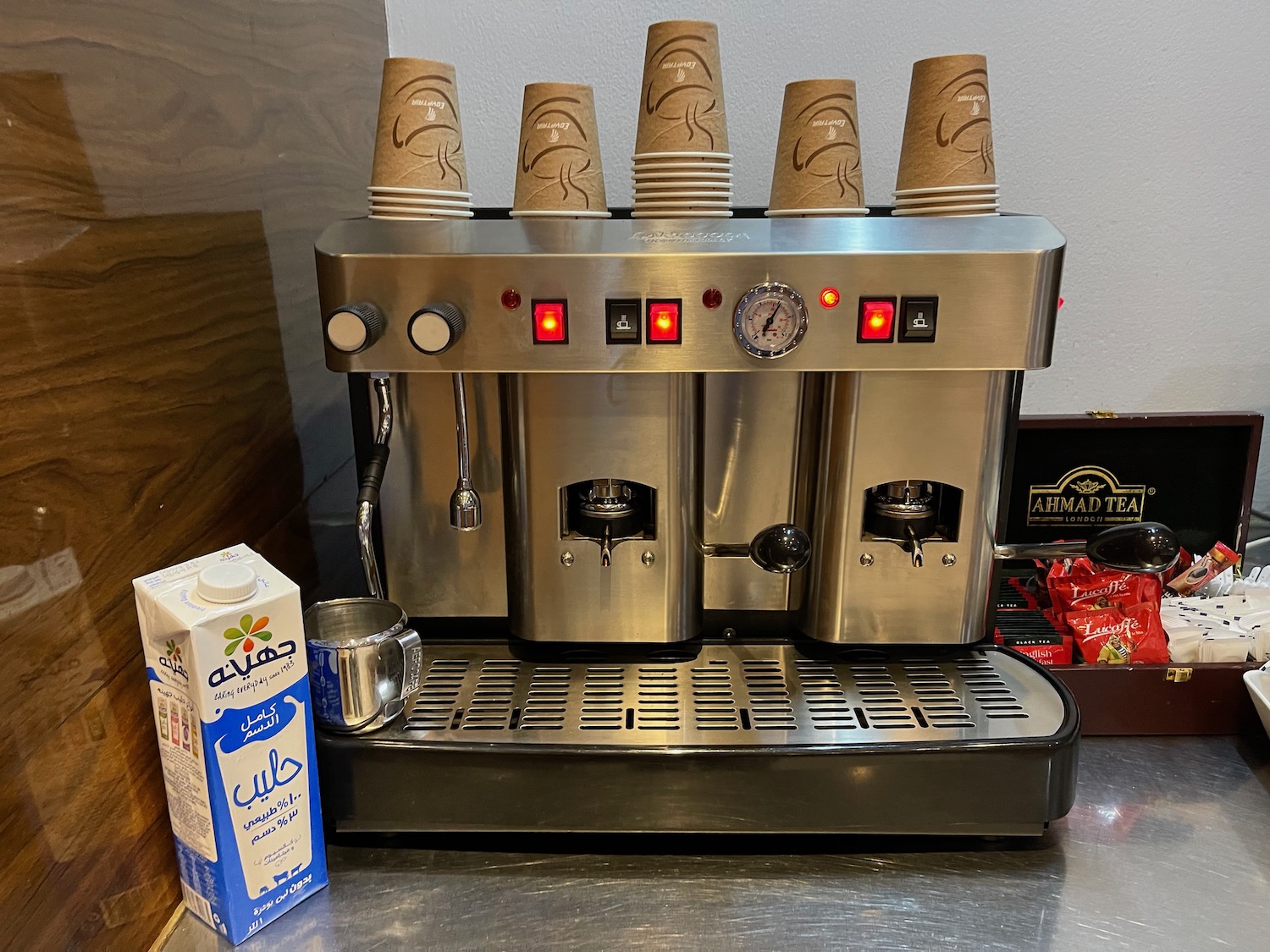 a coffee machine with cups on top
