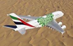 an airplane flying over a desert