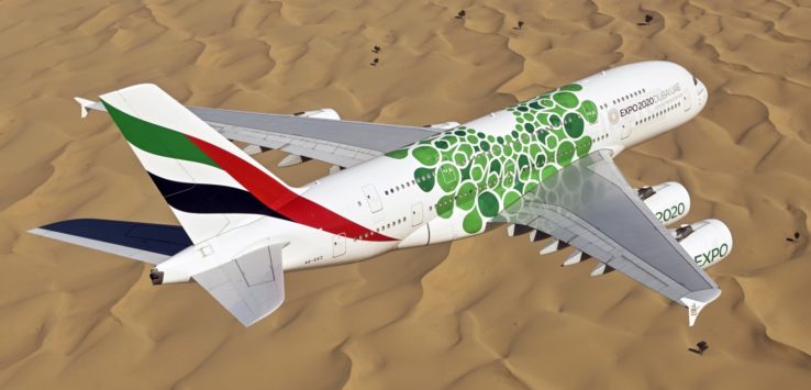 an airplane flying over a desert