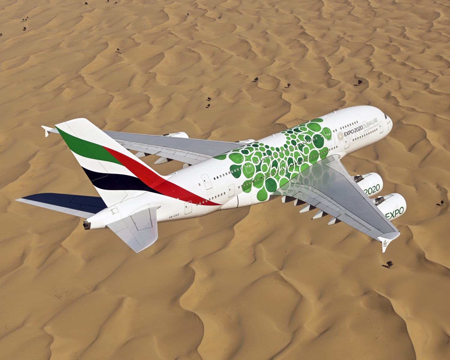 an airplane flying over a desert
