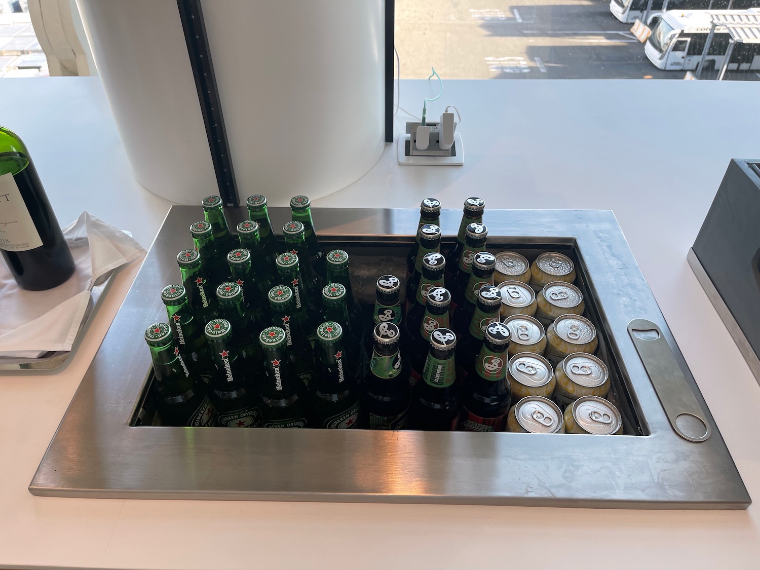 a group of beer bottles in a metal container