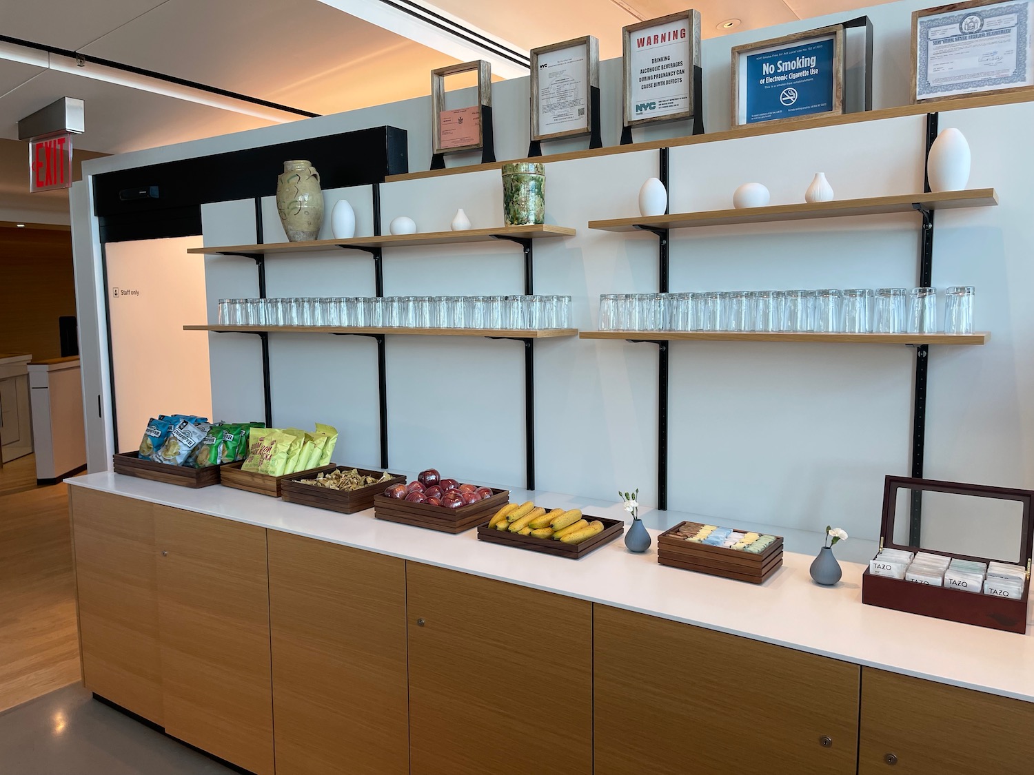 a shelf with food and glasses on it