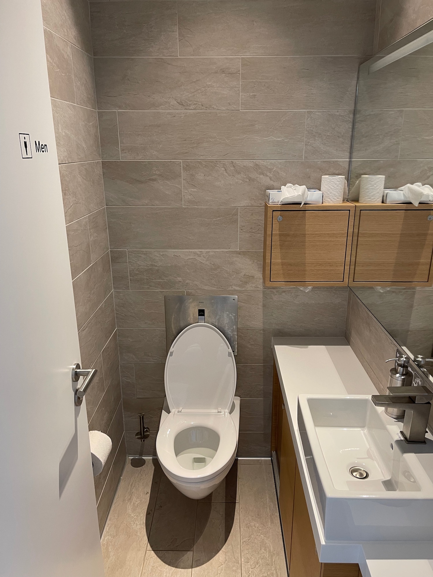 a bathroom with a toilet and sink