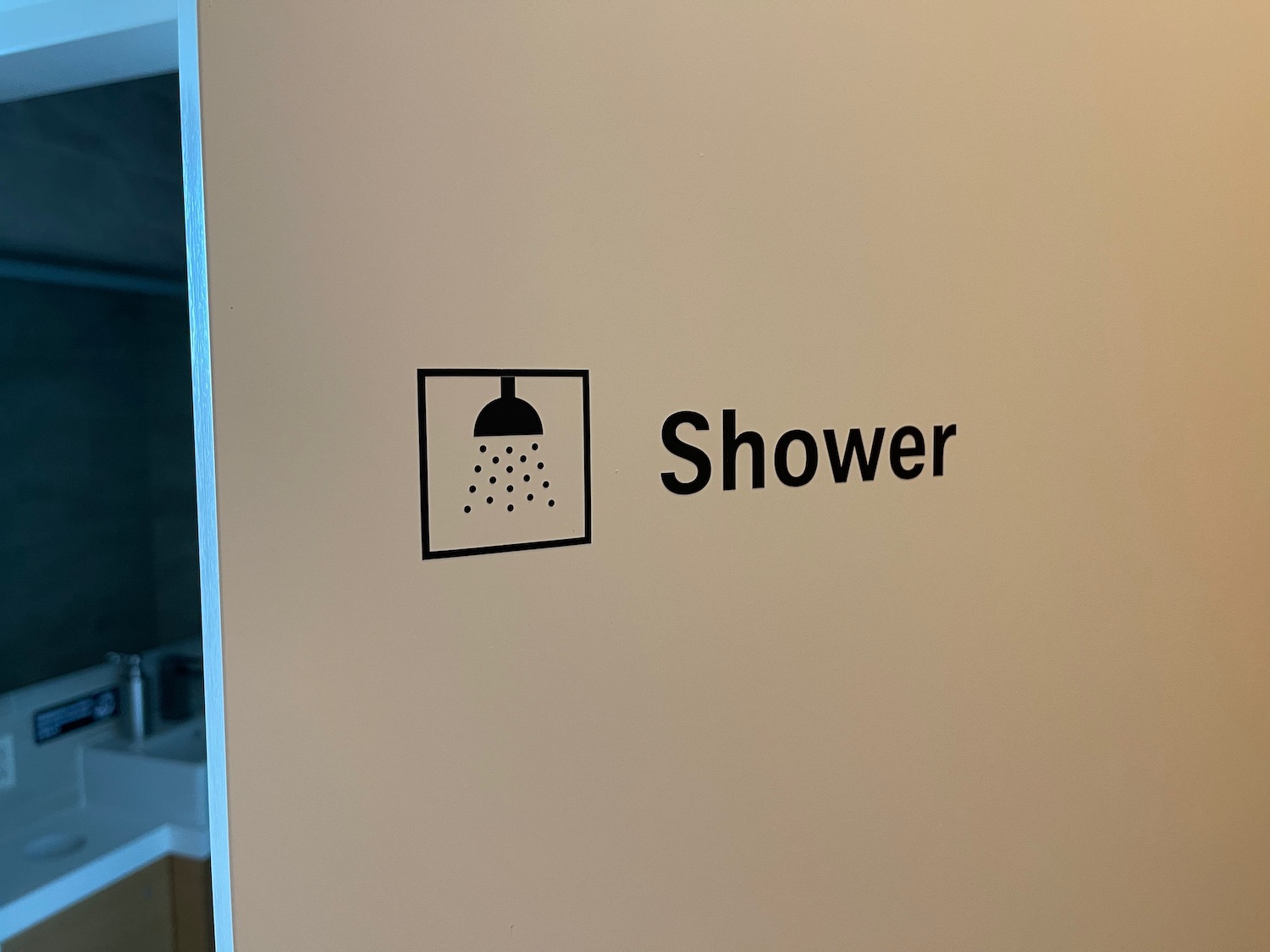 a shower sign on a wall