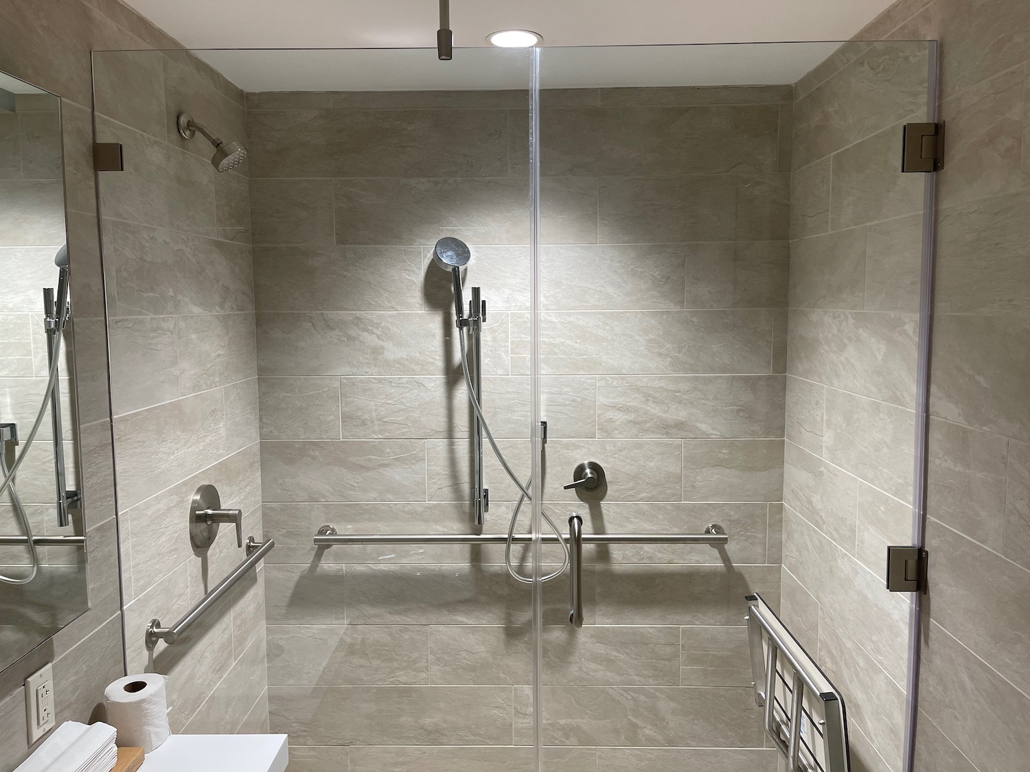 a shower with a stand up shower