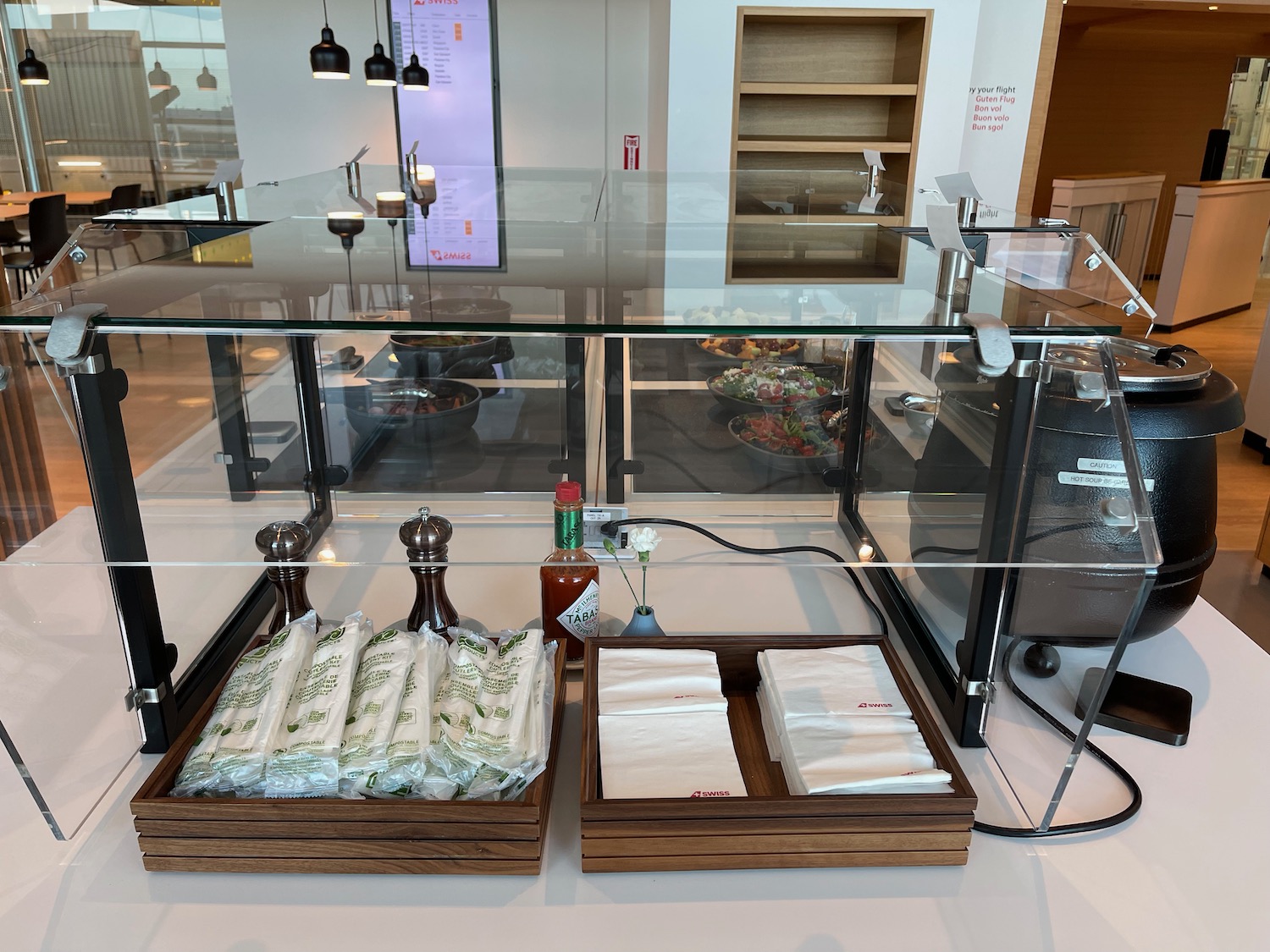 a glass display case with food items on it