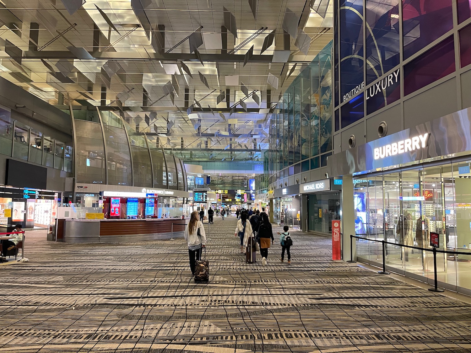 people walking in a large airport